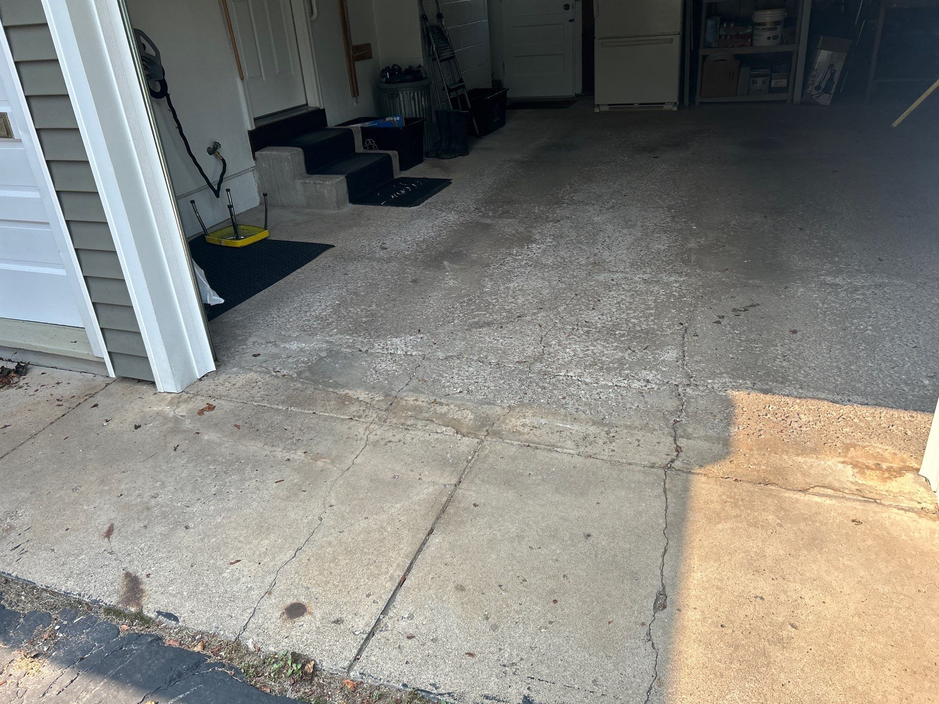 Concrete garage floor replacement with a broom finished apron by NG Masonry & Construction LLC