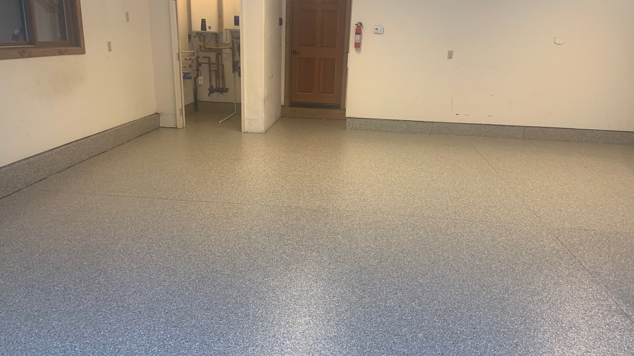 Garage Transformation using Pebble Beach by Croc Coatings, LLC