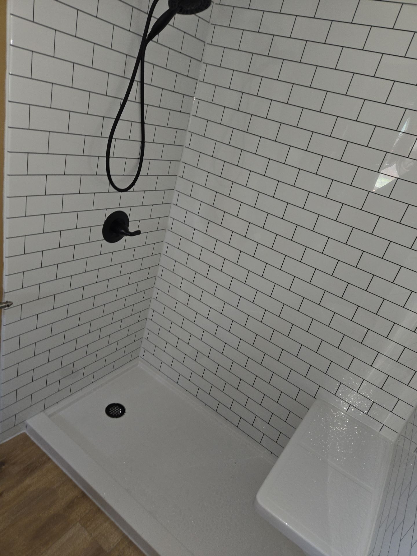 Bathroom Remodel using Luxury Vinyl Plank by The Shower Company