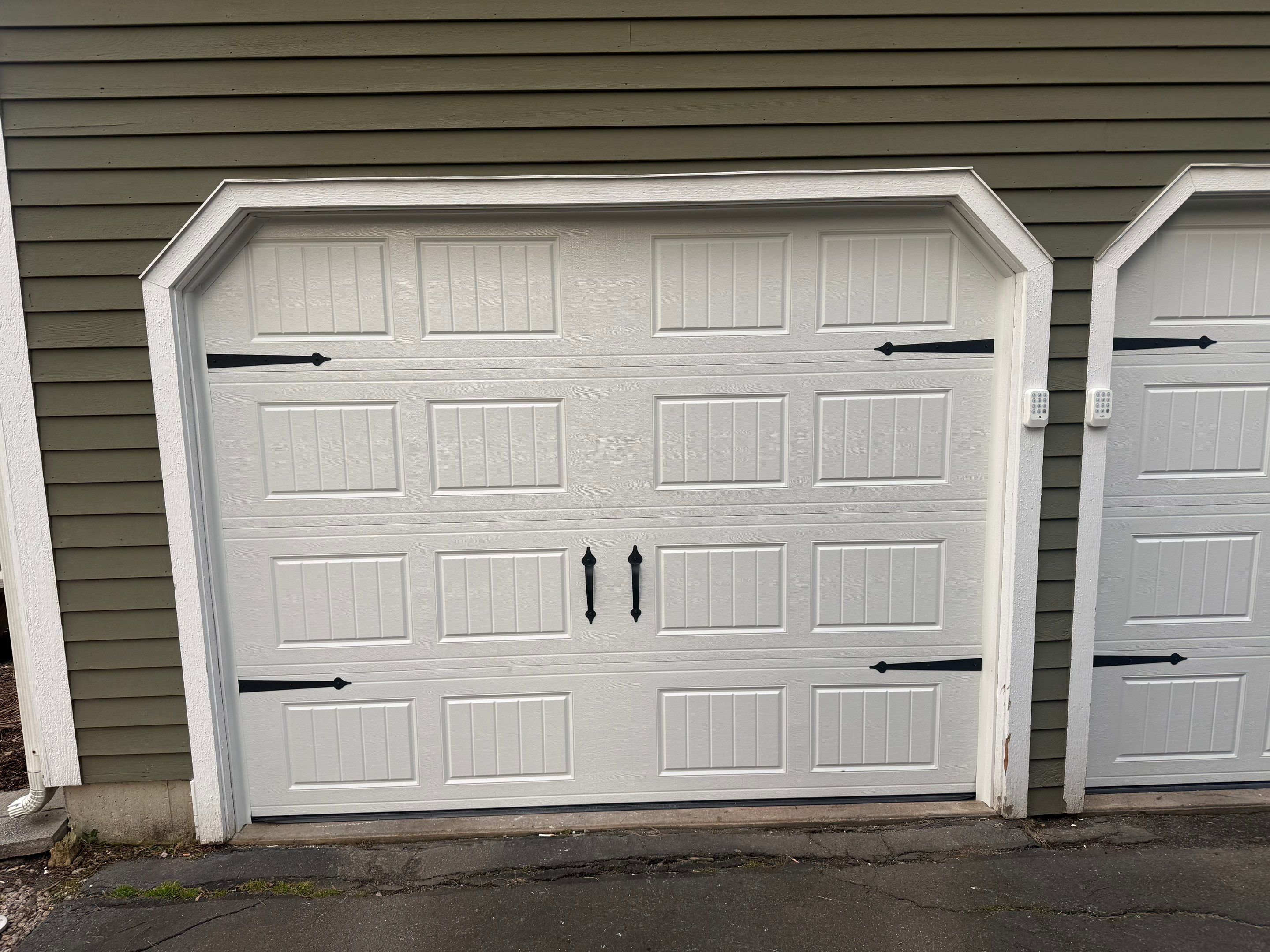 Clean Garage Door Upgrade with Modern Hardware Detail by DiGiorgi Roofing and Siding Inc