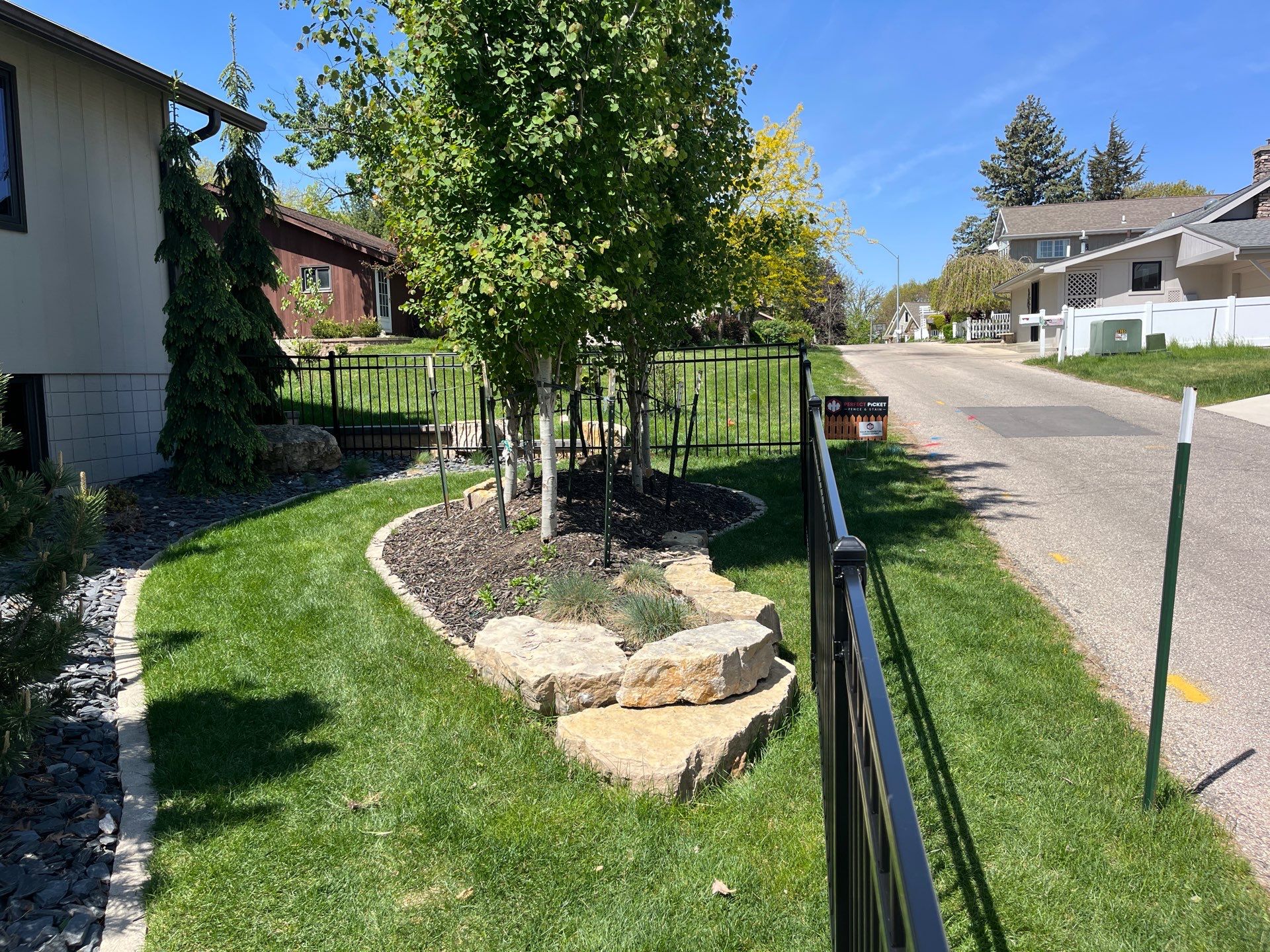 Ornamental Black Metal Picket Fence Installation in Cedar Falls by Perfect Picket Fence and Stain
