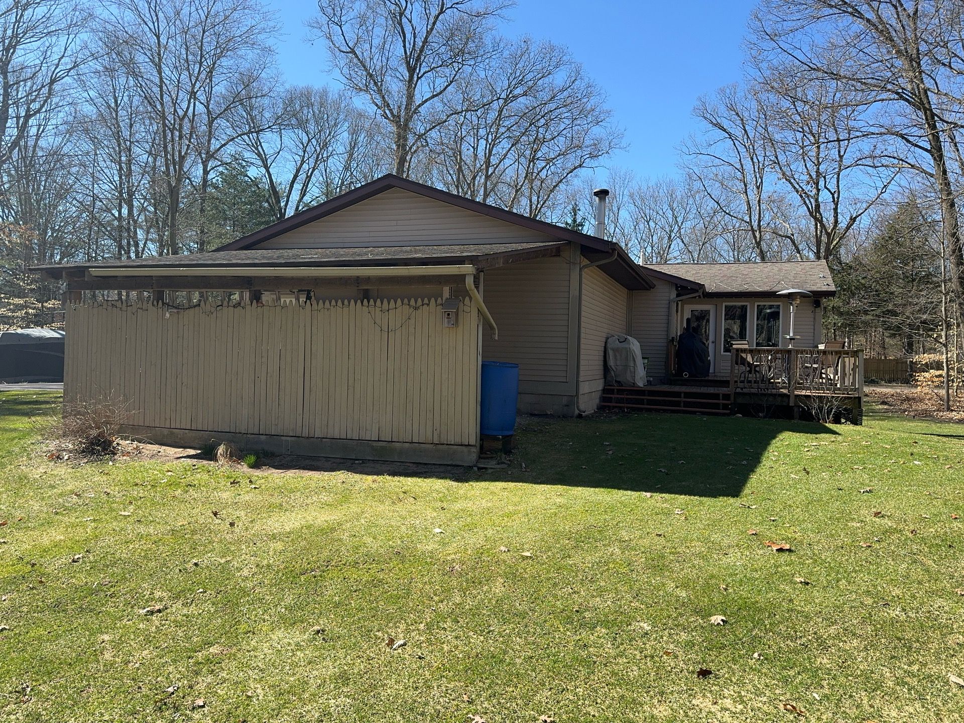 Siding, Deck and Versetta Stone by Avalon Roofing and Exteriors