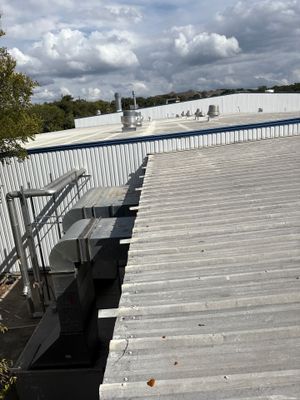 Metal roof panels with HVAC units on roof