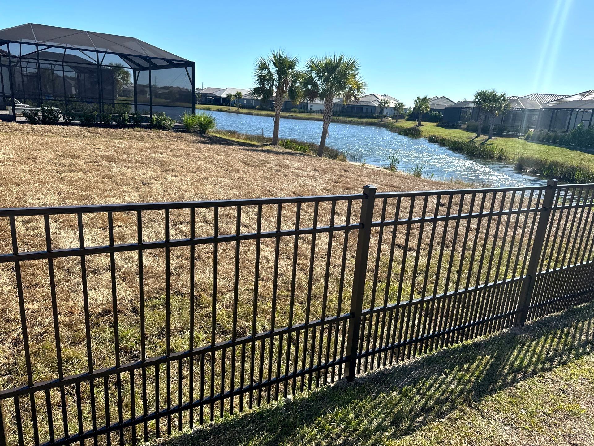 Aluminum Fence Installation using 4Ft 3 Rail Bronze Puppy Picket Aluminum Fence by Asap fence and gates, LLC