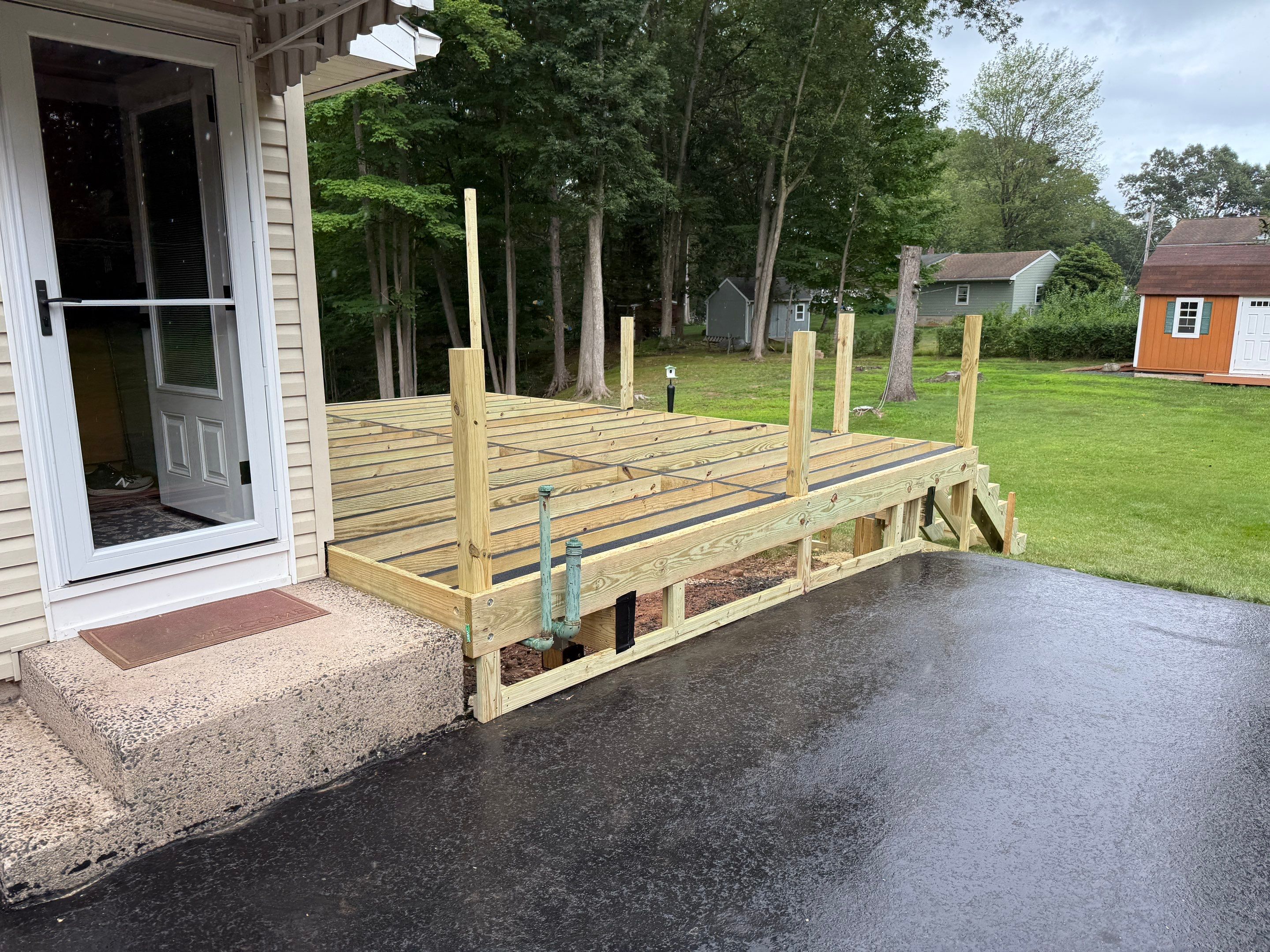 Replacement Deck, Trex Tropical Tiki torch , Matching Fascia. Black Transcend railing and Lattice. by DiGiorgi Roofing and Siding Inc
