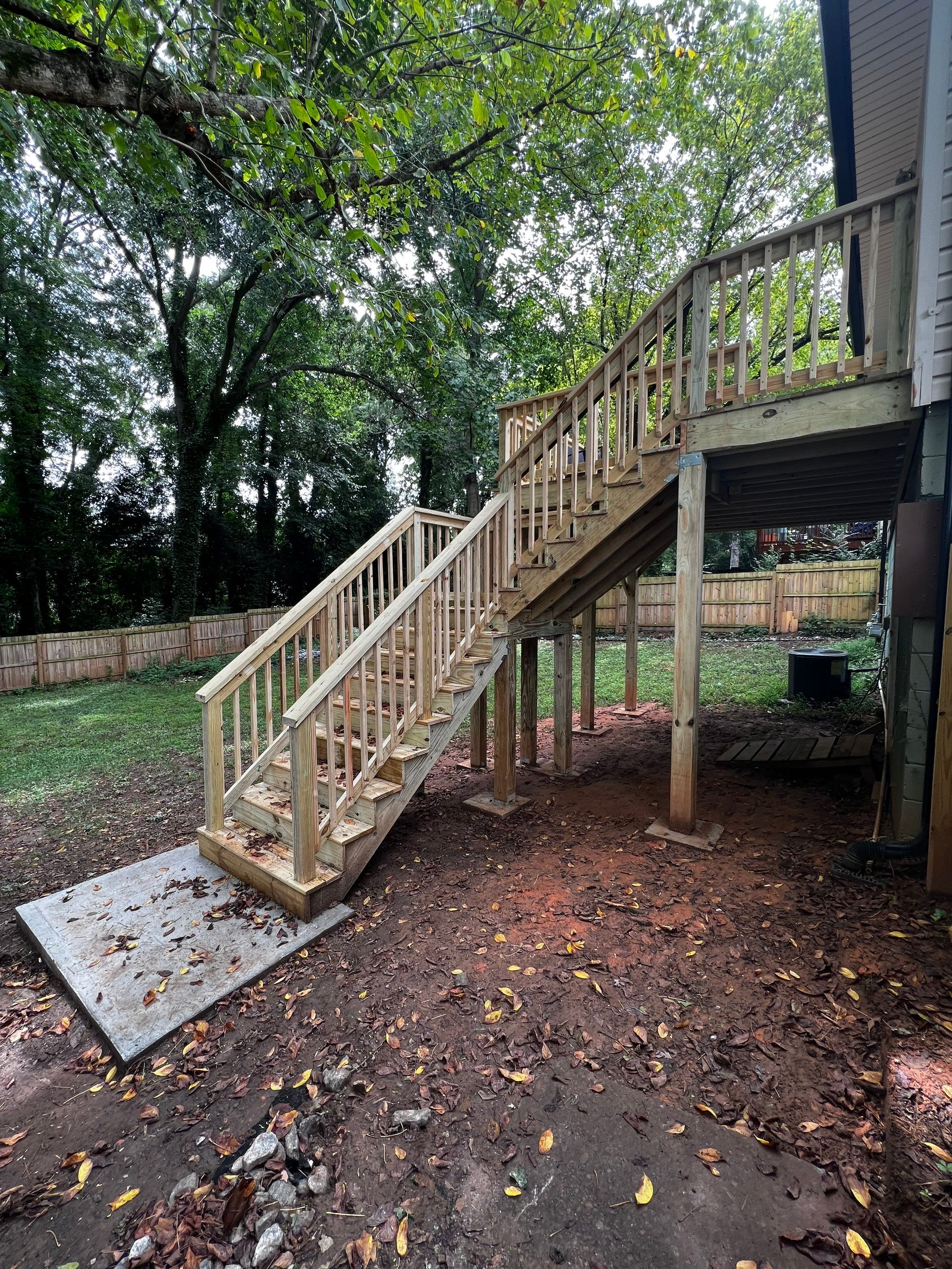 Elevated Pressure-Treated Wood Deck and Staircase Replacement in Atlanta by Swift Home Renovations