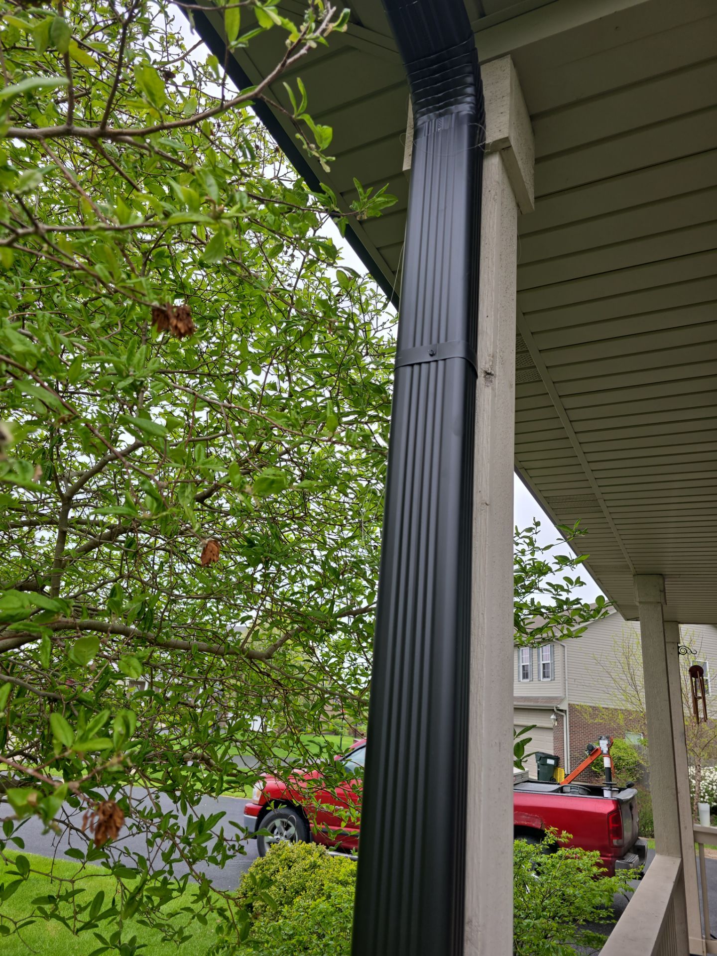 New black gutters and roof by Optimal Home Improvement 