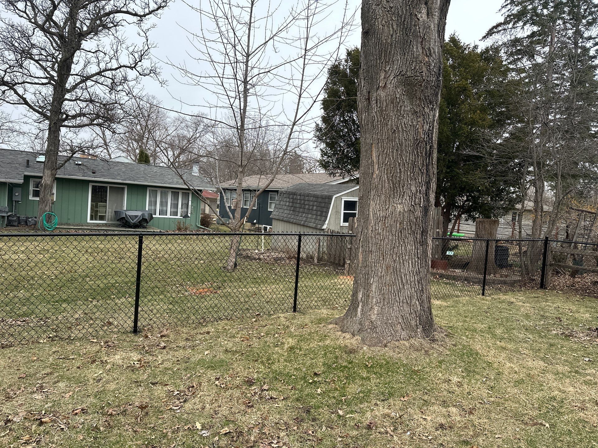 Black Vinyl Chain Link Fence Installation in Cedar Falls by Perfect Picket Fence and Stain