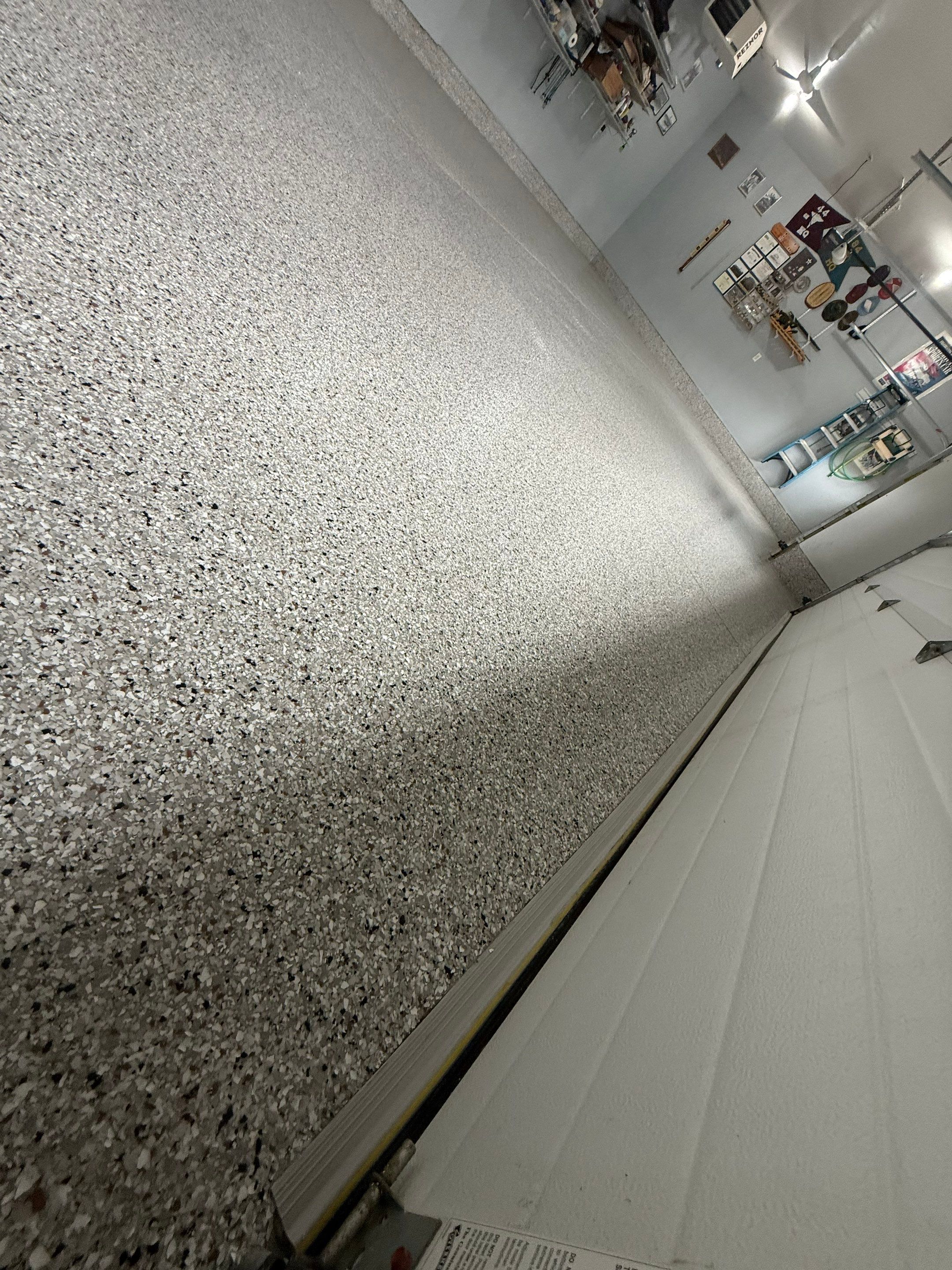 High-Gloss Epoxy Garage Floor Coating in Sioux Falls by Select Painting, Coatings & Garage Cabinets