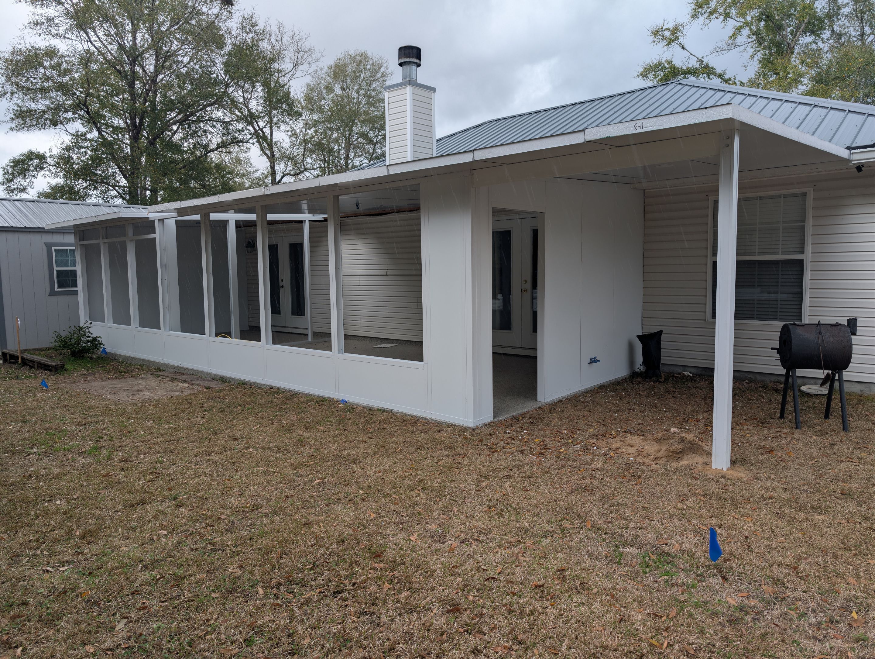 Large Divided Glass Room with Patio cover by Titan Sunrooms