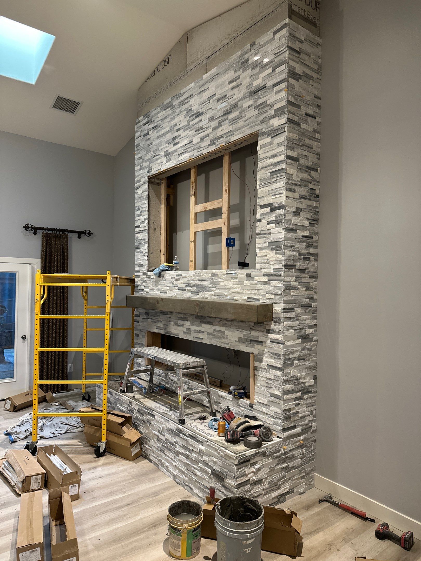 Stacked Stone Electric Fireplace by Footprints Floors of Chandler 
