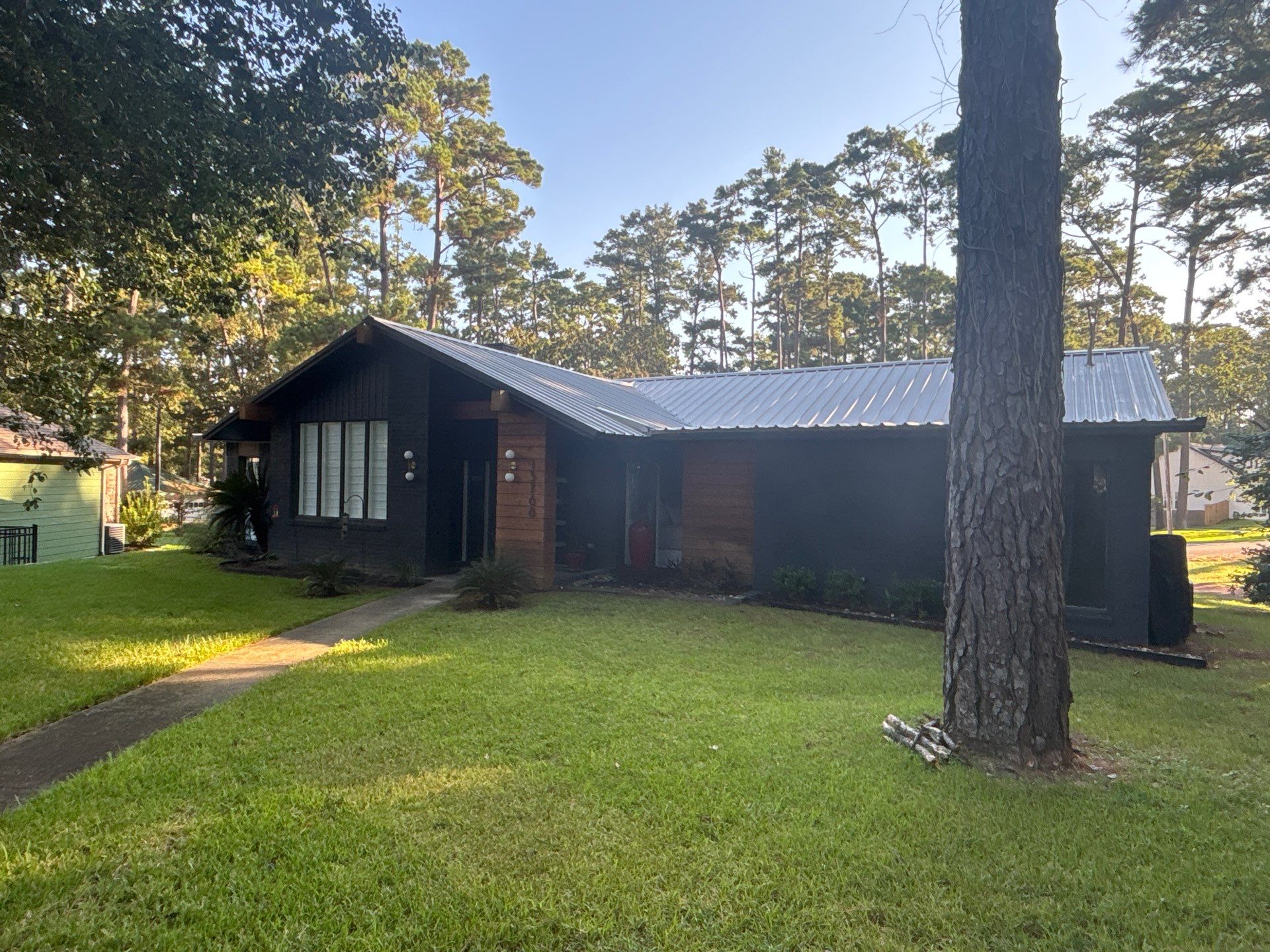 White Standing Seam Metal Roof Replacement in Willis, Texas by Abbott Roofing Company