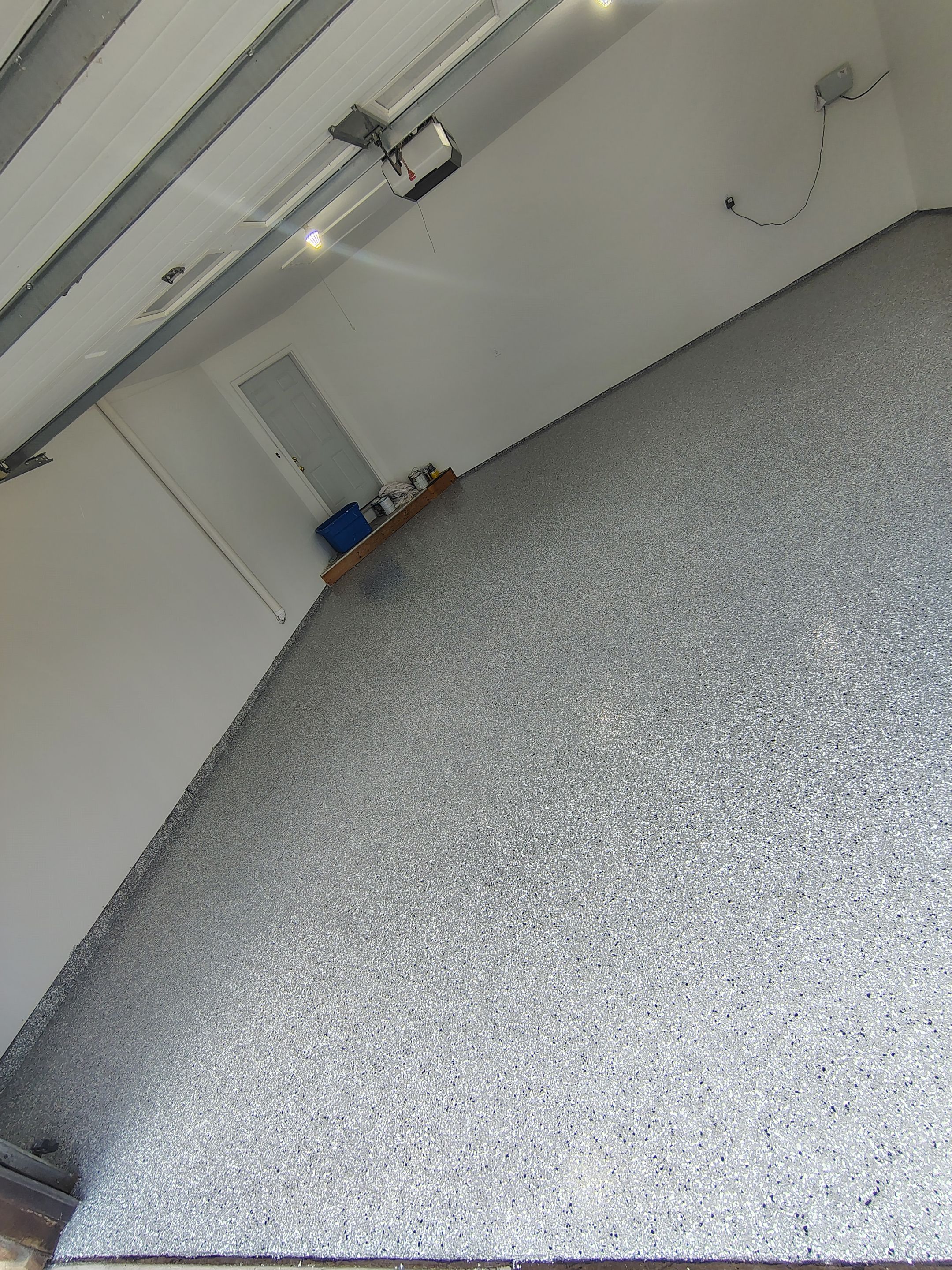 Sioux Falls Garage Floor Coating with Speckled Flake Finish by Select Painting, Coatings & Garage Cabinets