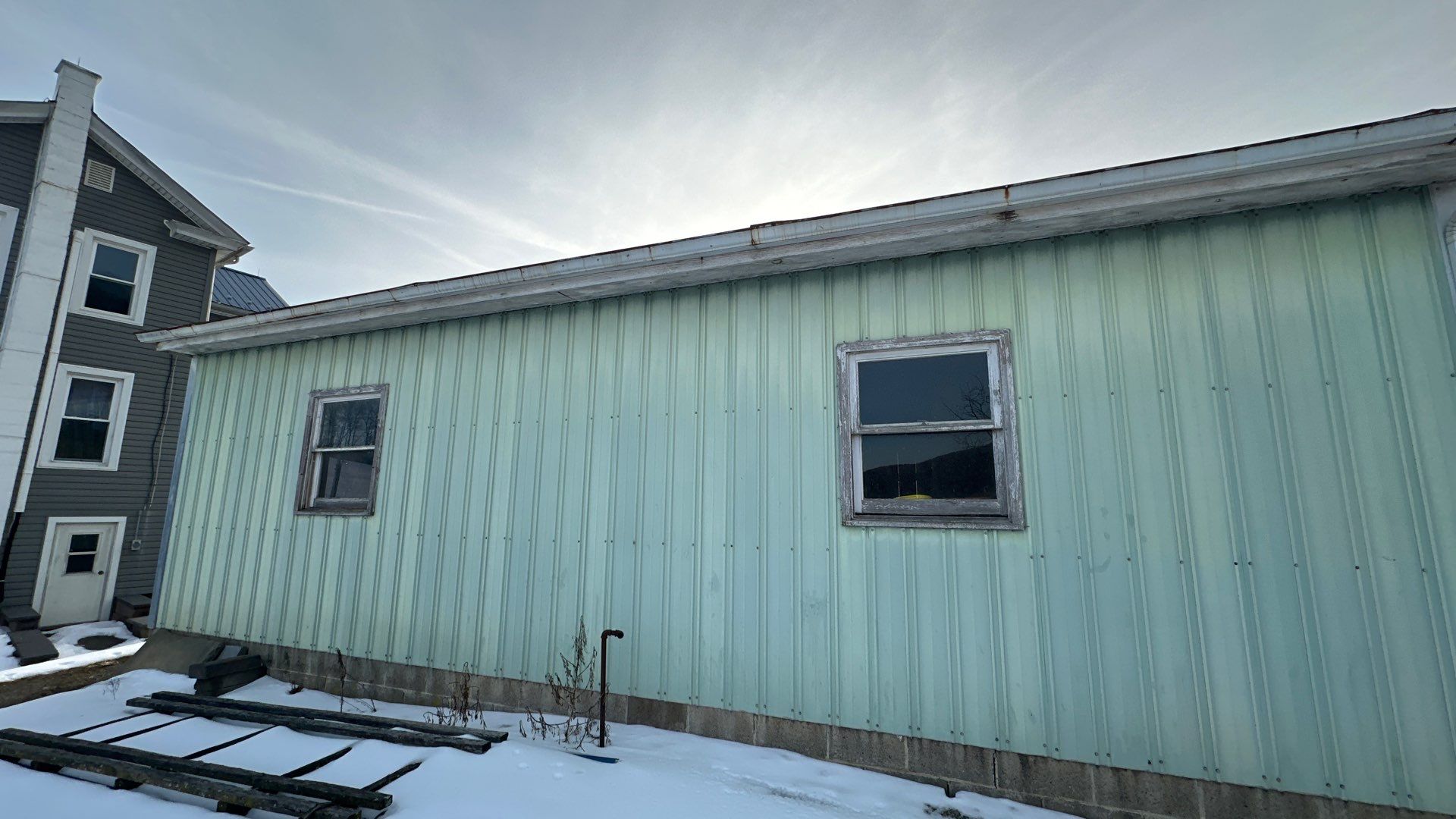 3-Car Garage refresh Blue Metal Roofing in Herndon by Esh Builders