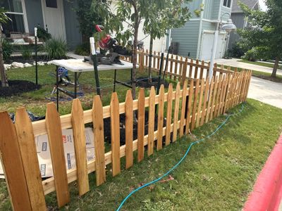 Austin Residential Wooden Picket Fence Installation and Solid Color Staining