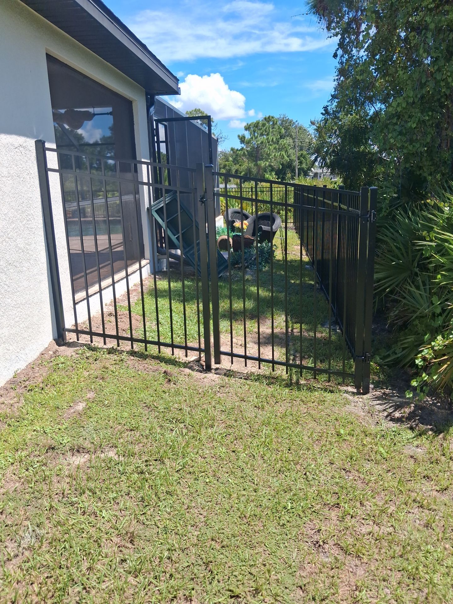 Black Aluminum Perimeter Fence and Gate Installation in Port Charlotte by True Fence LLC