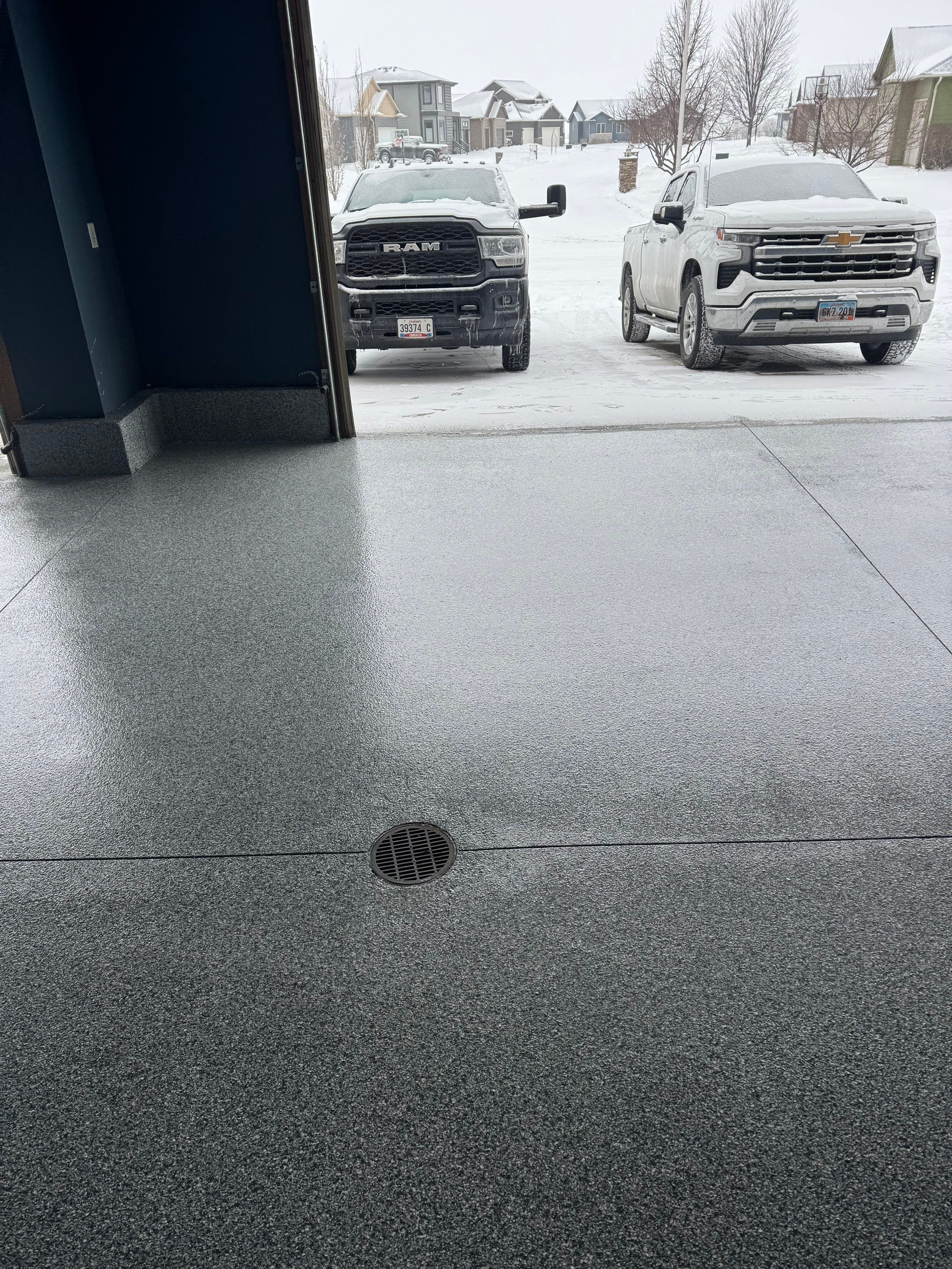 Grey Speckled Epoxy Garage Floor and Stair Coating in Sioux Falls by Select Painting, Coatings & Garage Cabinets