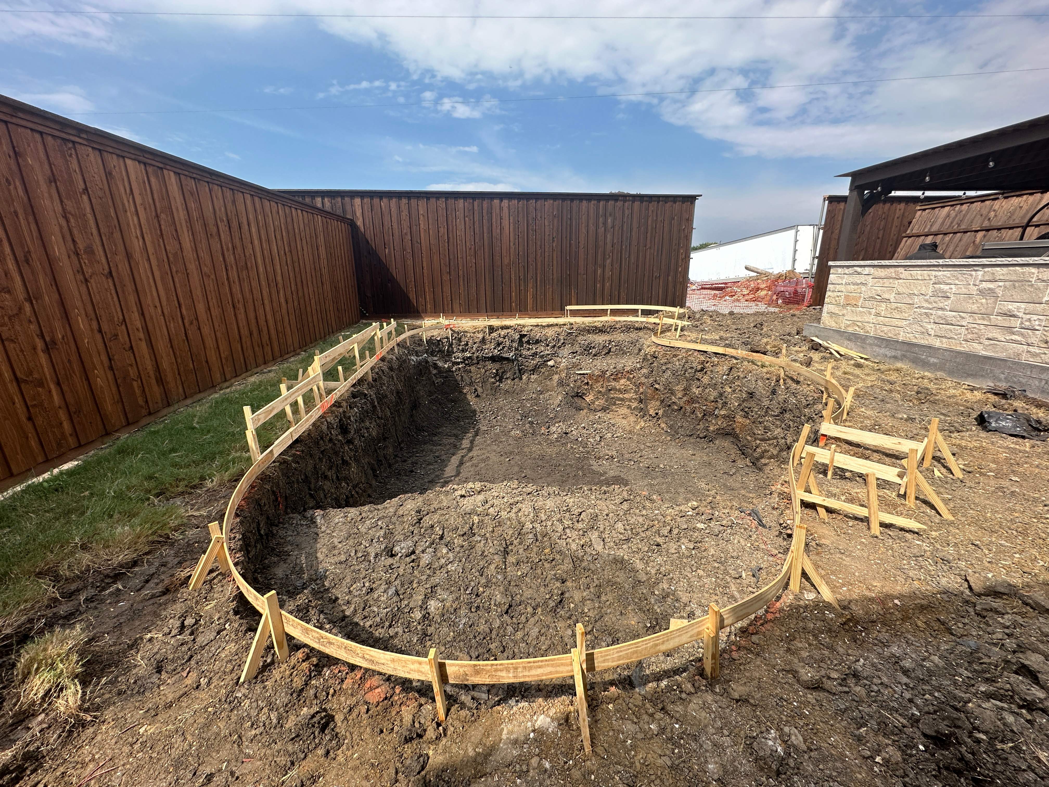 Freeform Pool with Rock Waterfall and Raised Spa by Pinnacle Pools and Spas - DFW