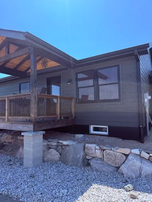 Seamless Black Gutter and Downspout Installation in Bear Lake