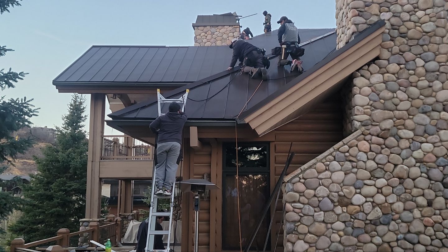 Standing Seam Metal Roof Replacement After Snow Damage by ASAP Roofing & Restoration
