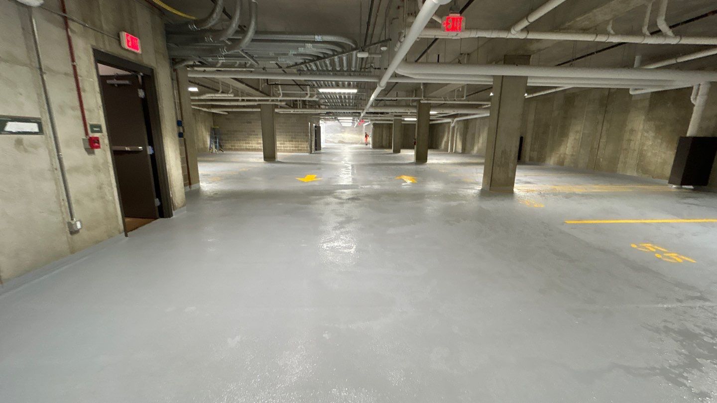 Parking garage using Hot water by Northern Power Washing LLC.