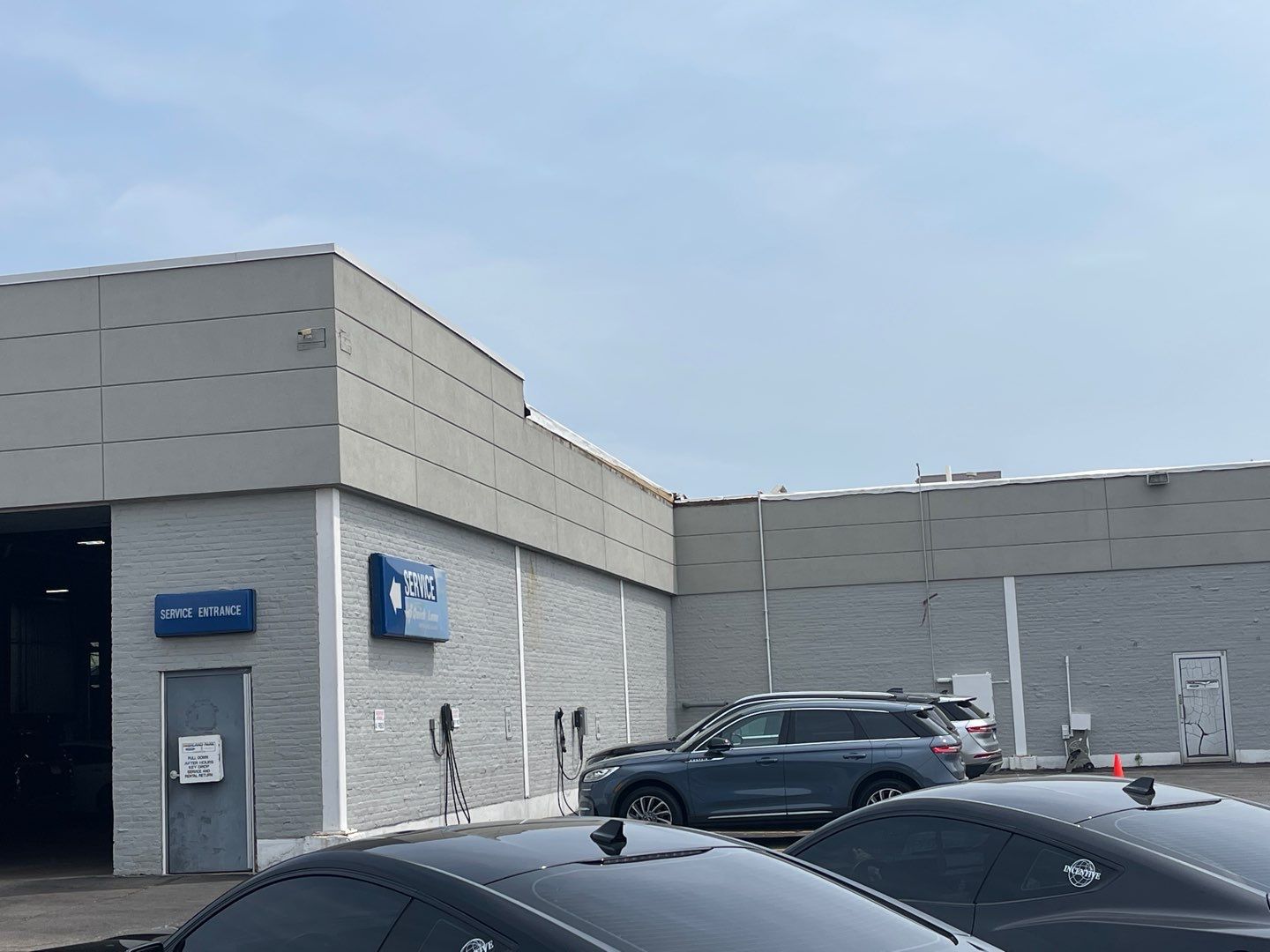 Ford Dealership - Re-Roof by Pink Roofing