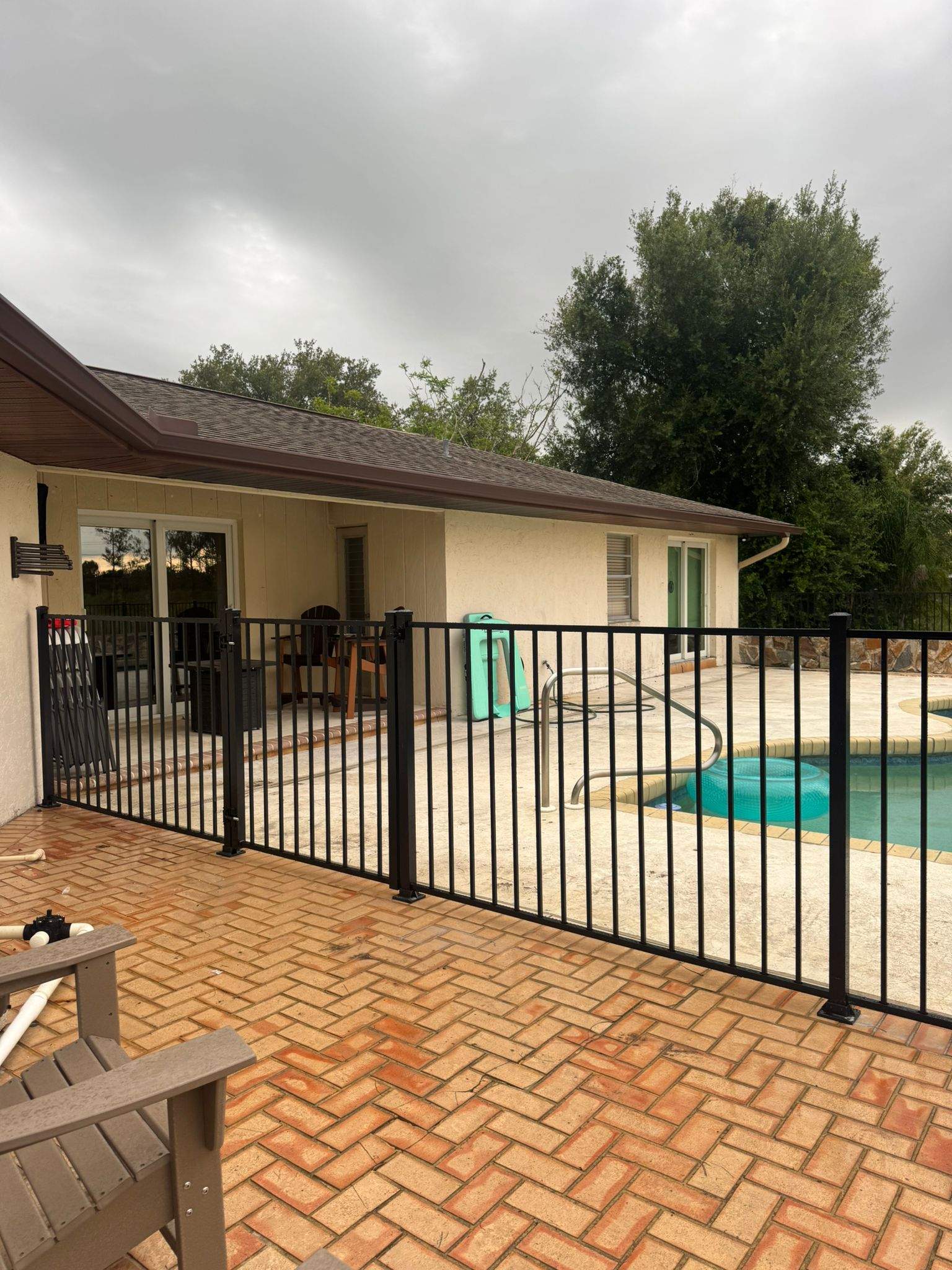 Black Aluminum Pool Safety Fence Installation in Punta Gorda by True Fence LLC