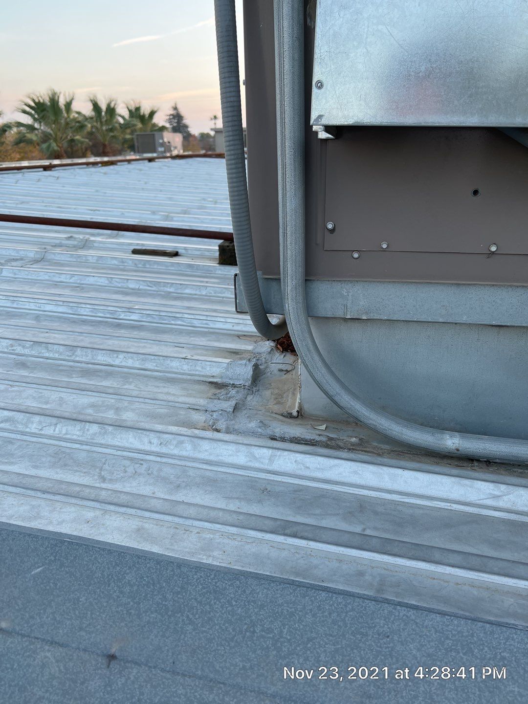 Metal roof restoration on commercial roof using Conklin Benchmark/ PUMA XL acrylic coatings over metal and foam by Straight Edge Roofing Inc