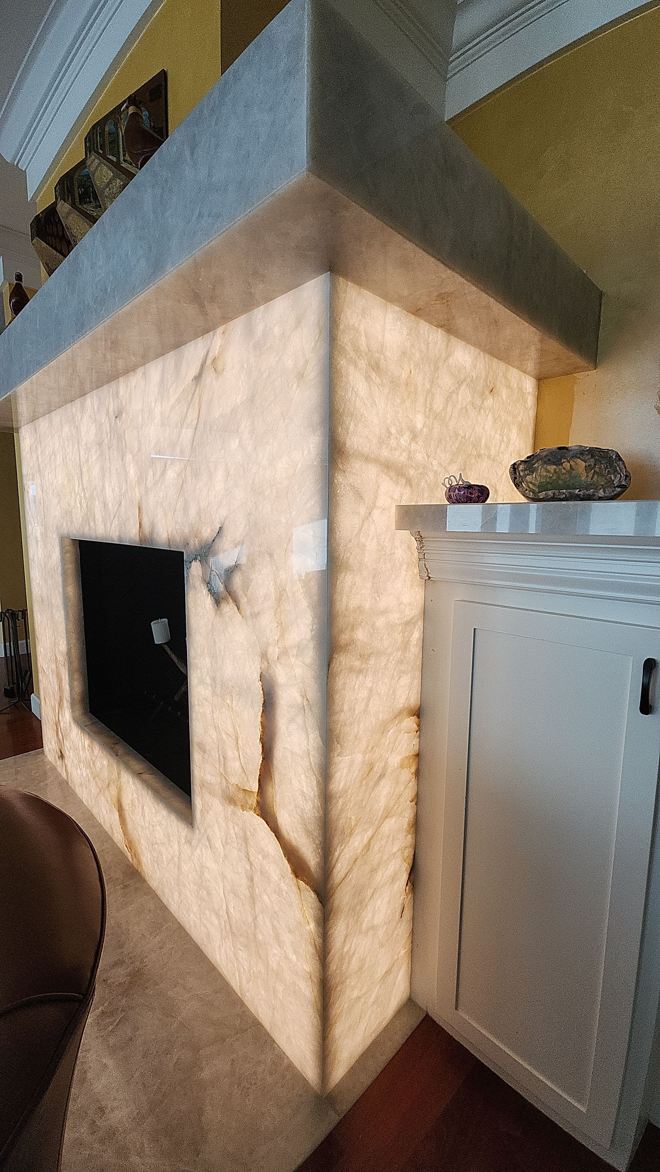 Backlit Stone On A Fireplace  by S.Y. Electric Inc.