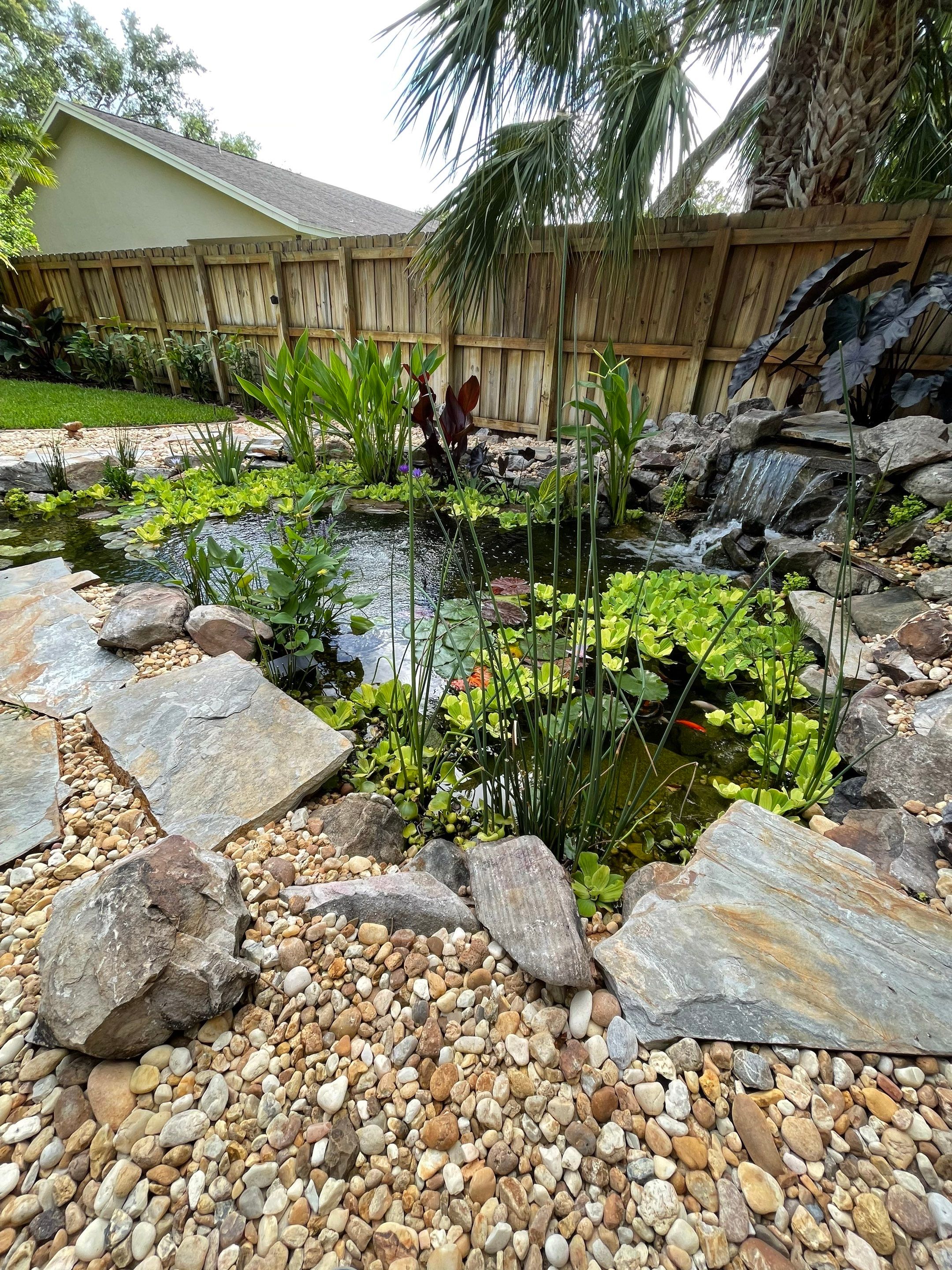 Small Koi Pond by Nature's Dream Landscape and Tree Service