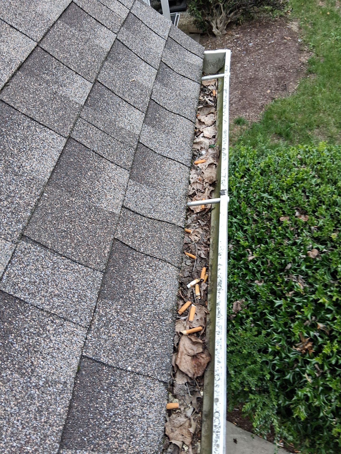 HOA gutter cleaning in Bowie & Largo, MD,before photo showing full gutters.
