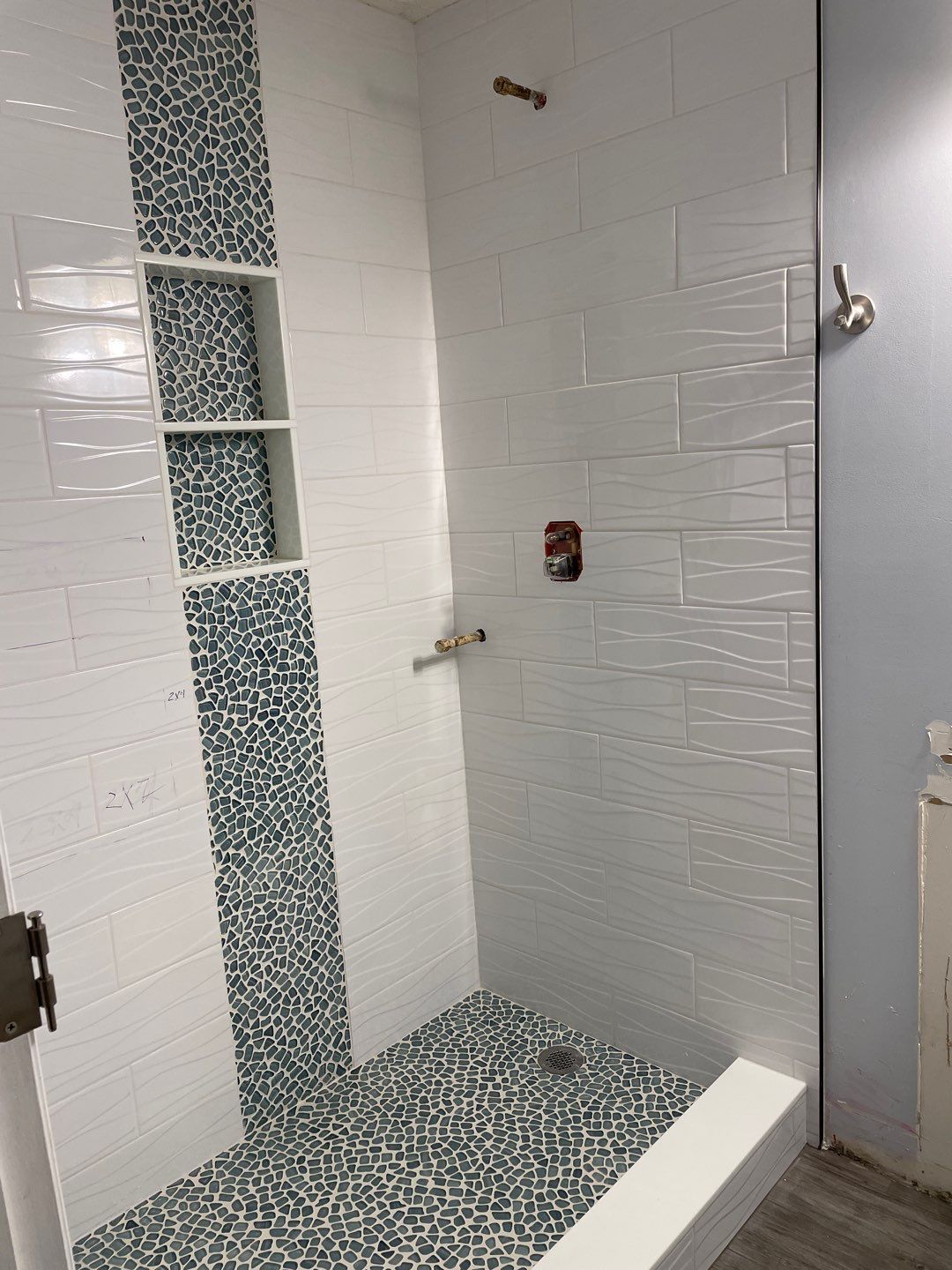 Sleek bathroom shower remodel by Footprints Floors of East Atlanta