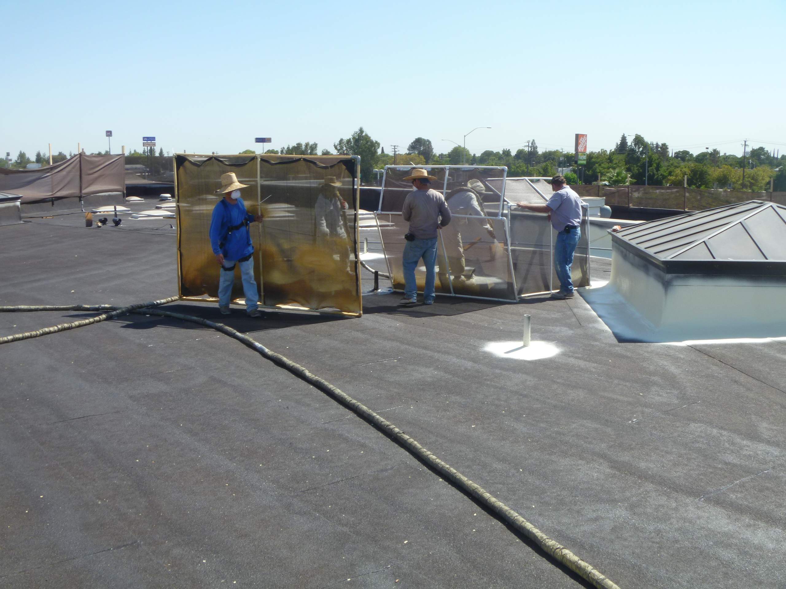 Commercial Roofing Installation using Spray foam and Conklin Benchmark/PUMA XL 18 yr warranty coatings by Straight Edge Roofing Inc