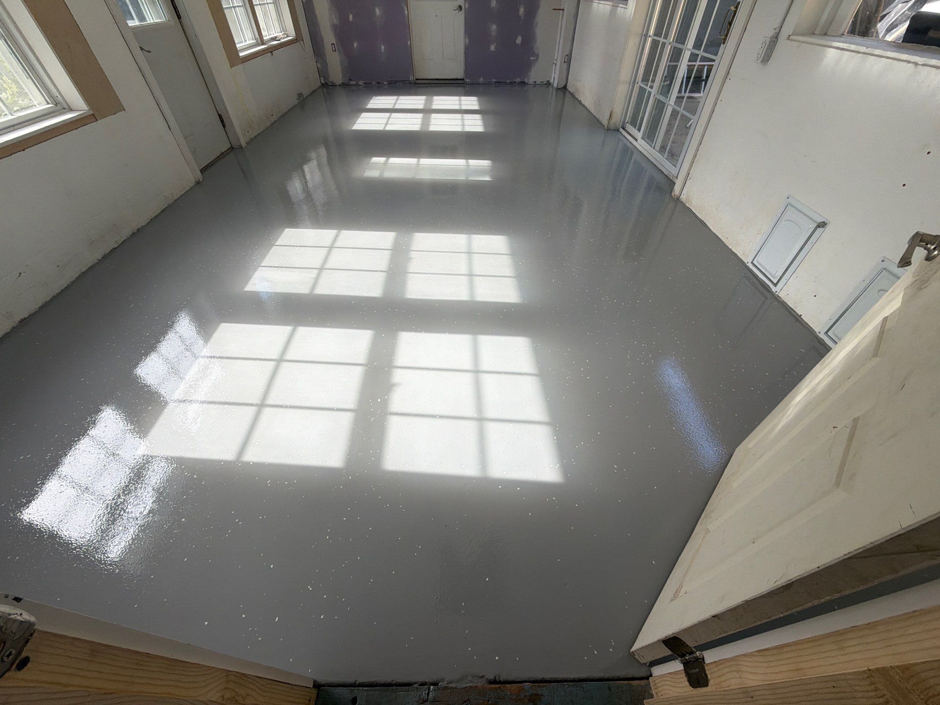 Grey Epoxy Flake Floor Installation for a Muskegon Sunroom by Gordon Painting