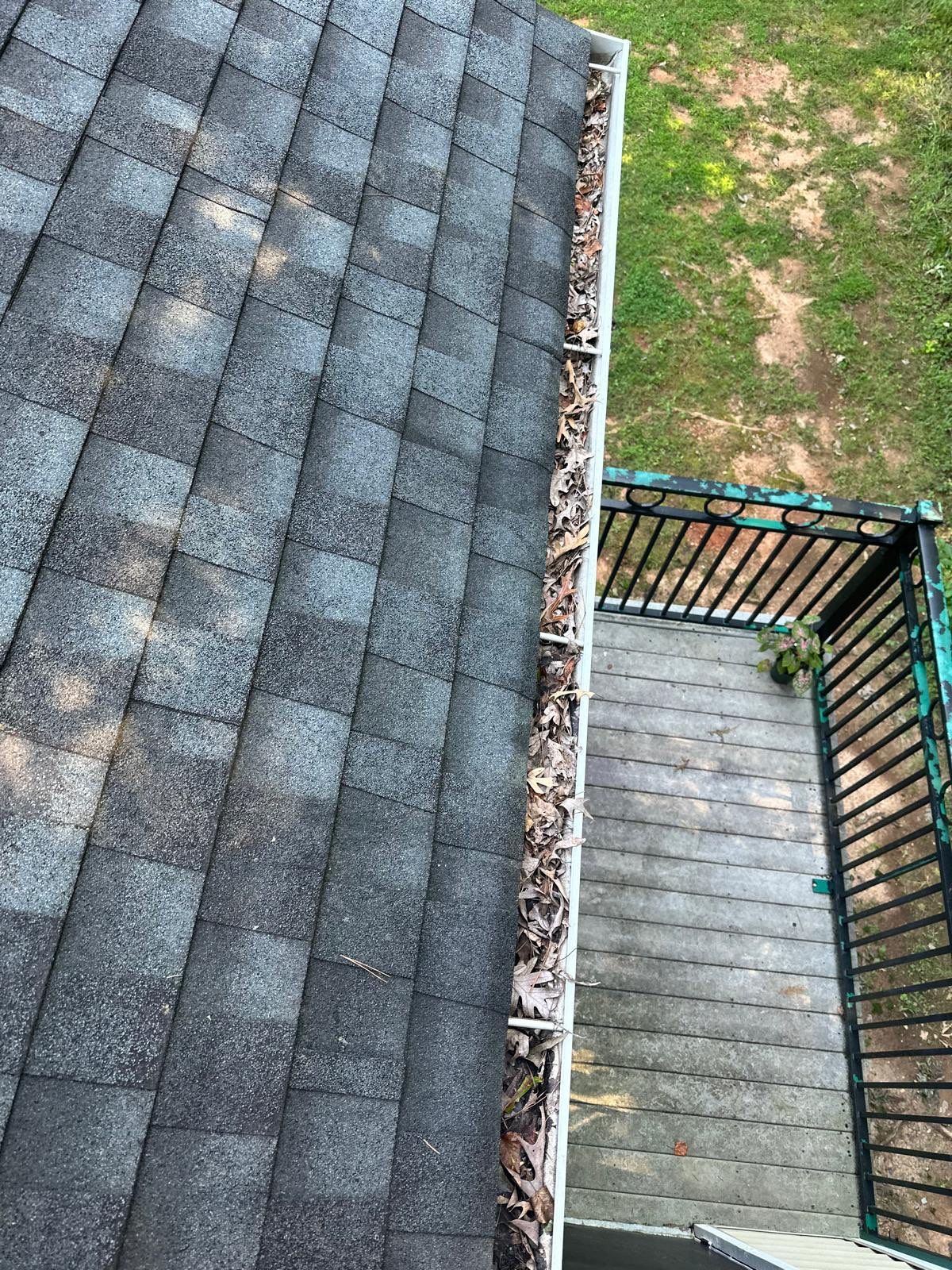 Commercial gutter cleaning Greensboro & Winston-Salem before photo with filled gutters