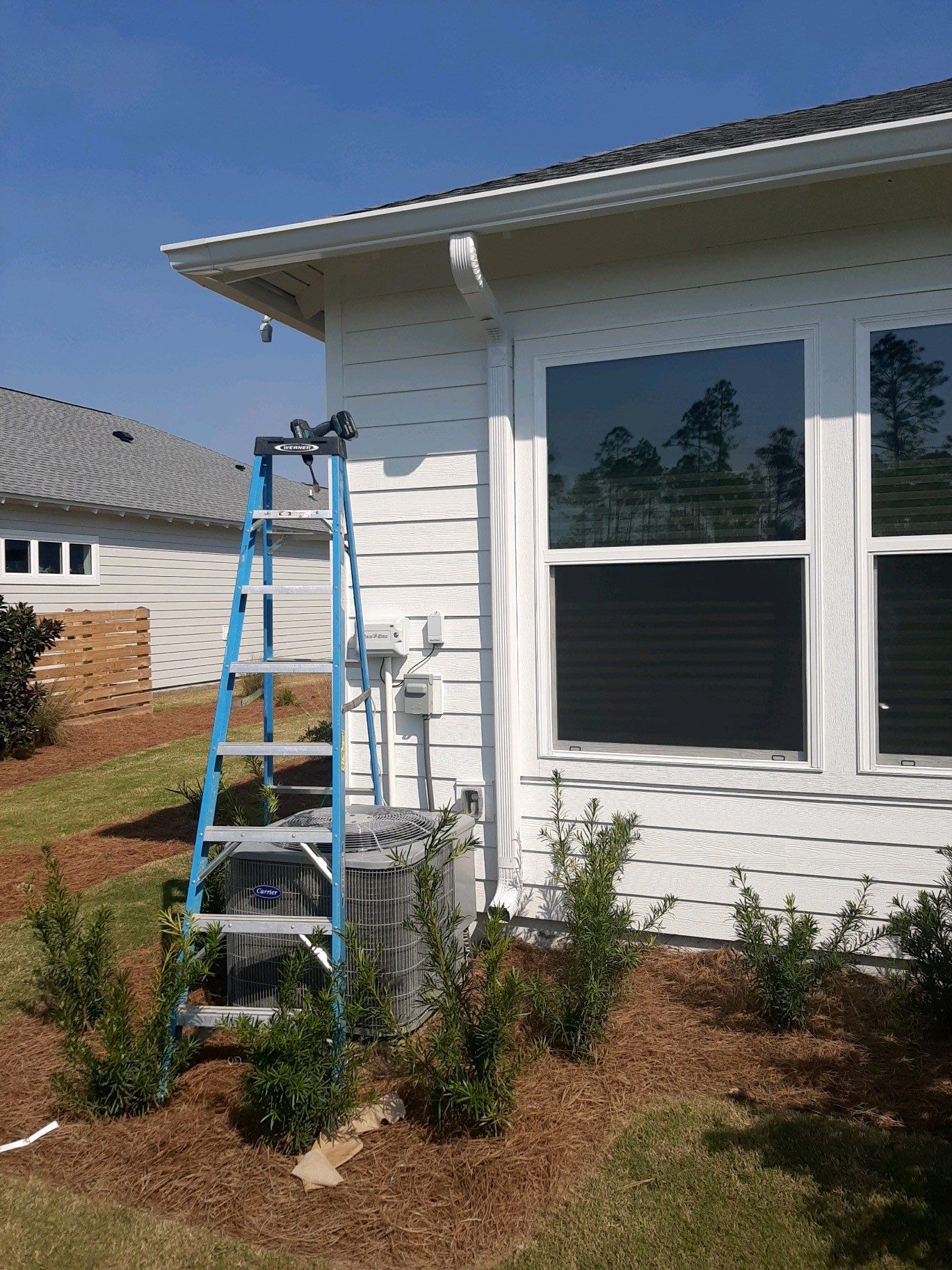 Gutter Installation Using White K-Style Aluminum Seamless Gutters by Gutter Professors