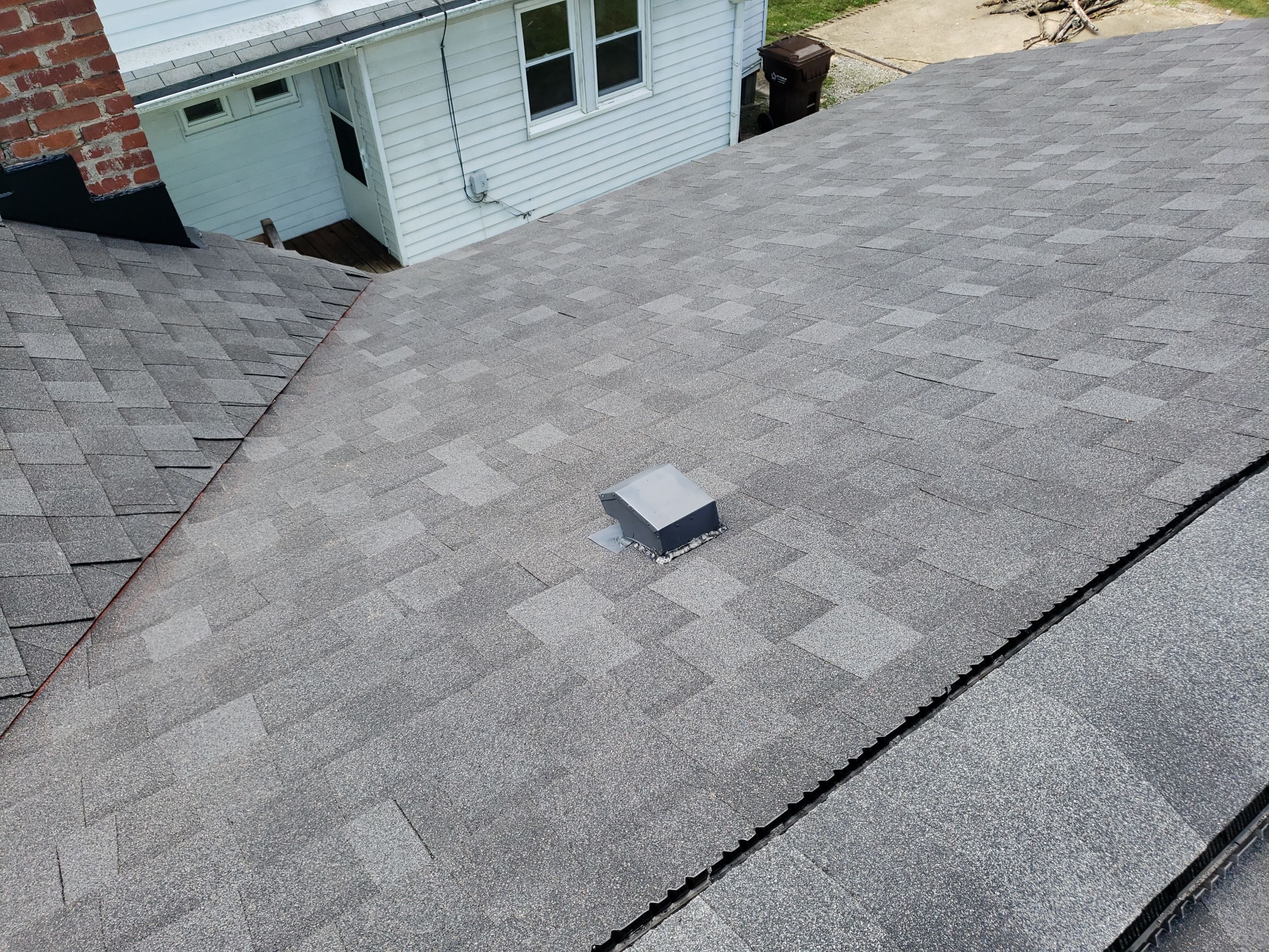 ATLAS PINNACLE COLOR: PRISTINE SCHOTCHGARD BLACK SHADOW DRIP EDGE: BLACK by Eagle Eye Roofing