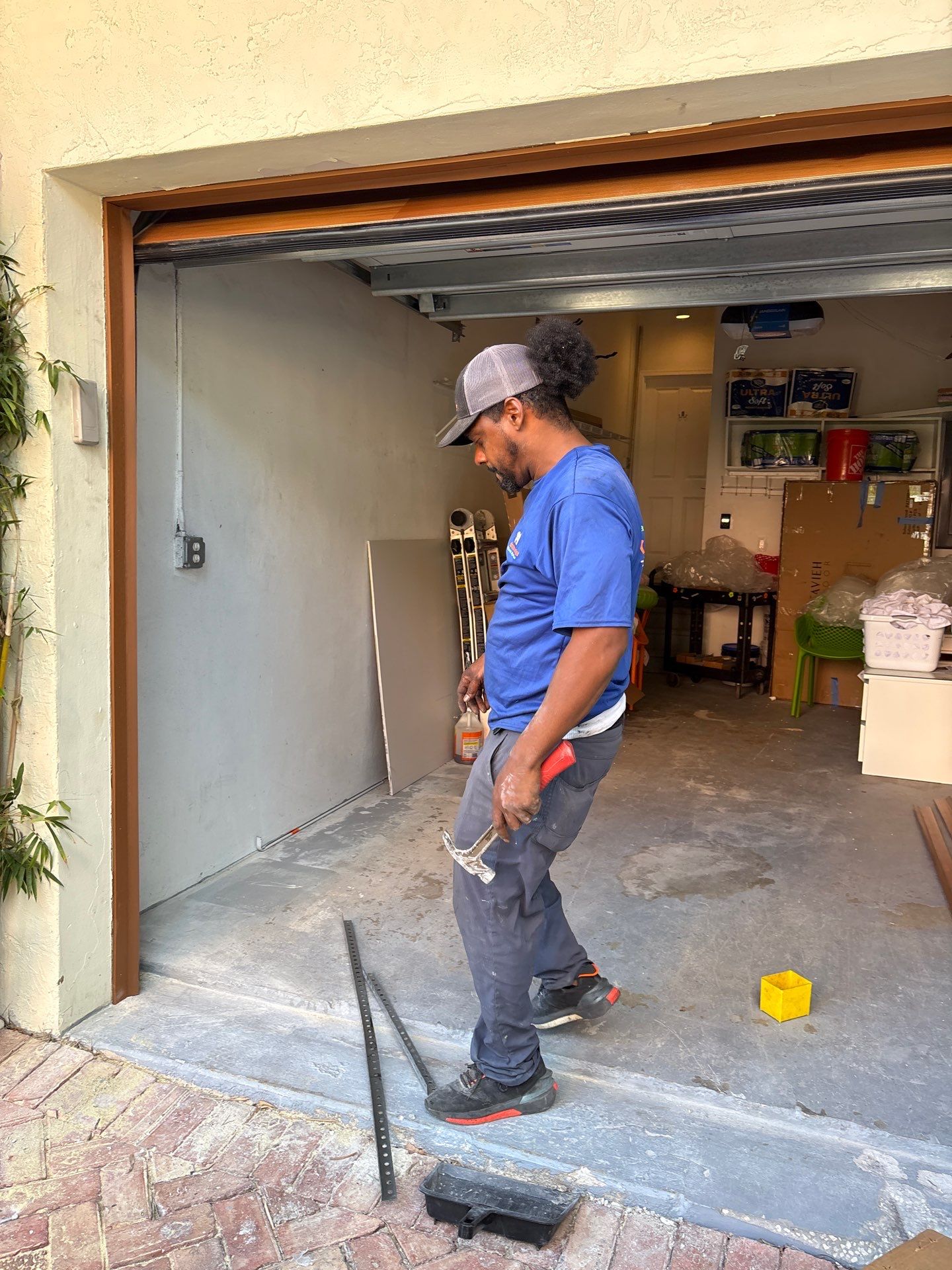 Modern Horizontal Wood Garage Door Installation in Fort Lauderdale by The Door Doctor of South Florida, Inc.