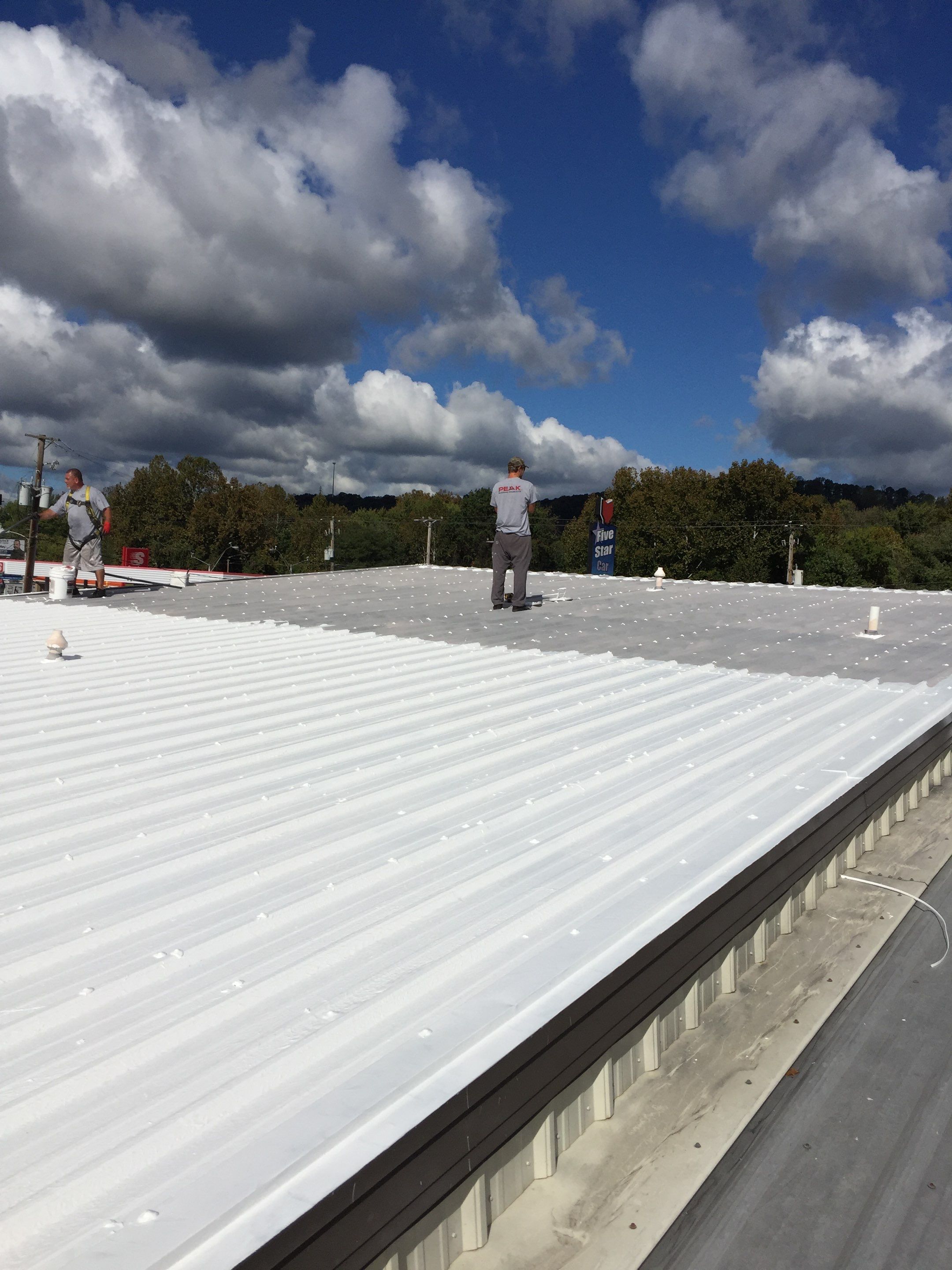 Commercial Roof Coating using Gaco Silicone Roof Coating by Secure Construction Company Inc
