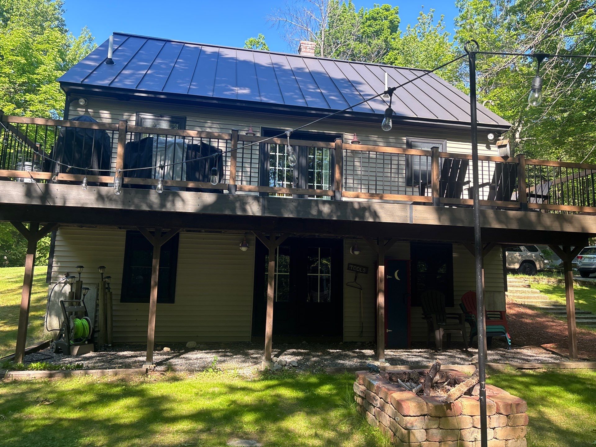 Sage Green Board and Batten Siding and Deck Upgrade in Standish by Tall pine roofing
