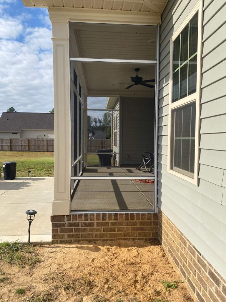 Custom Screened Porch Enclosure and Aluminum Railing in Hope Mills by The Remodeling Company
