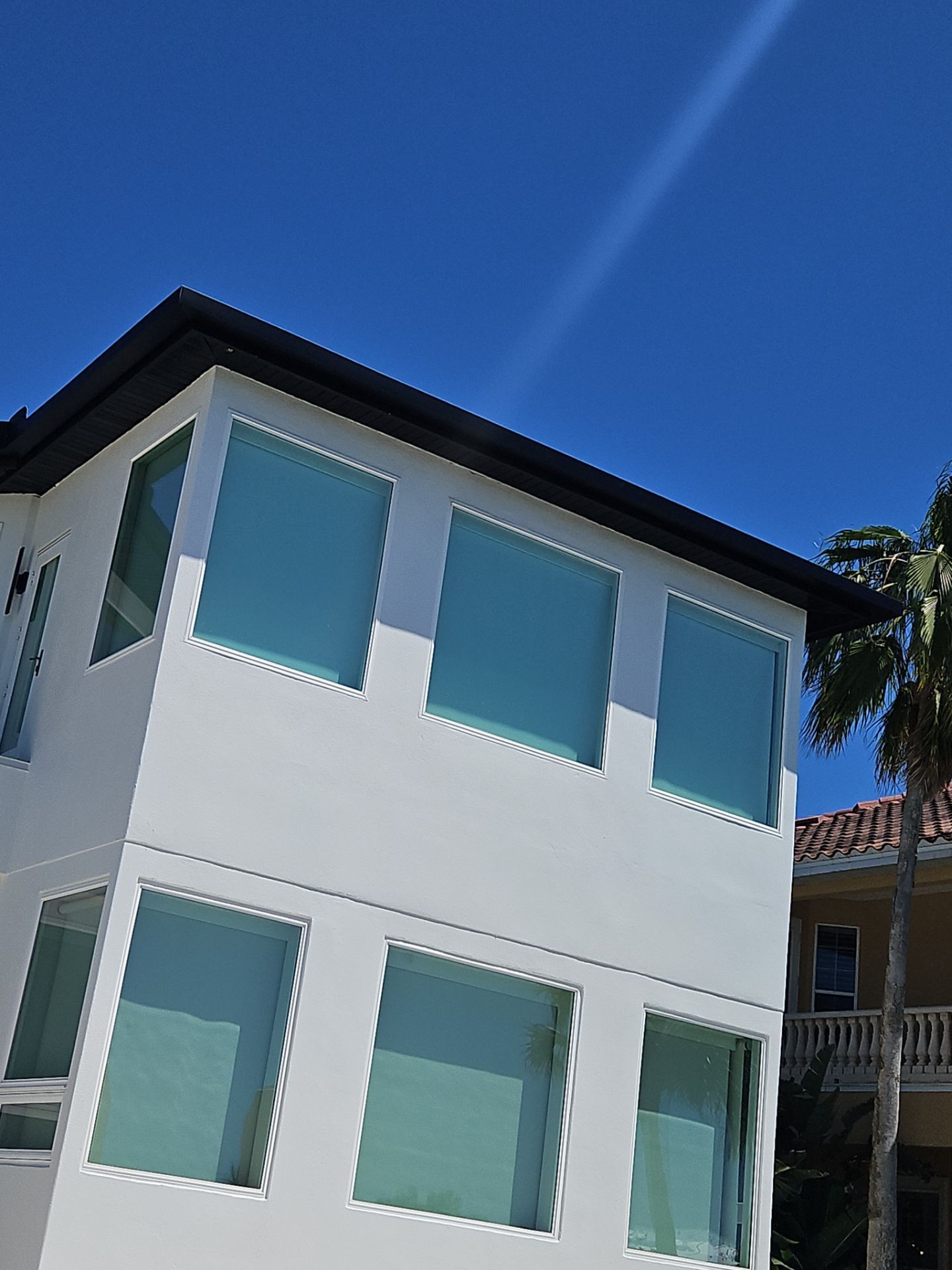 Soffit and Fascia Installation and black seamless gutters in Sarasota FL by Gutter Professors