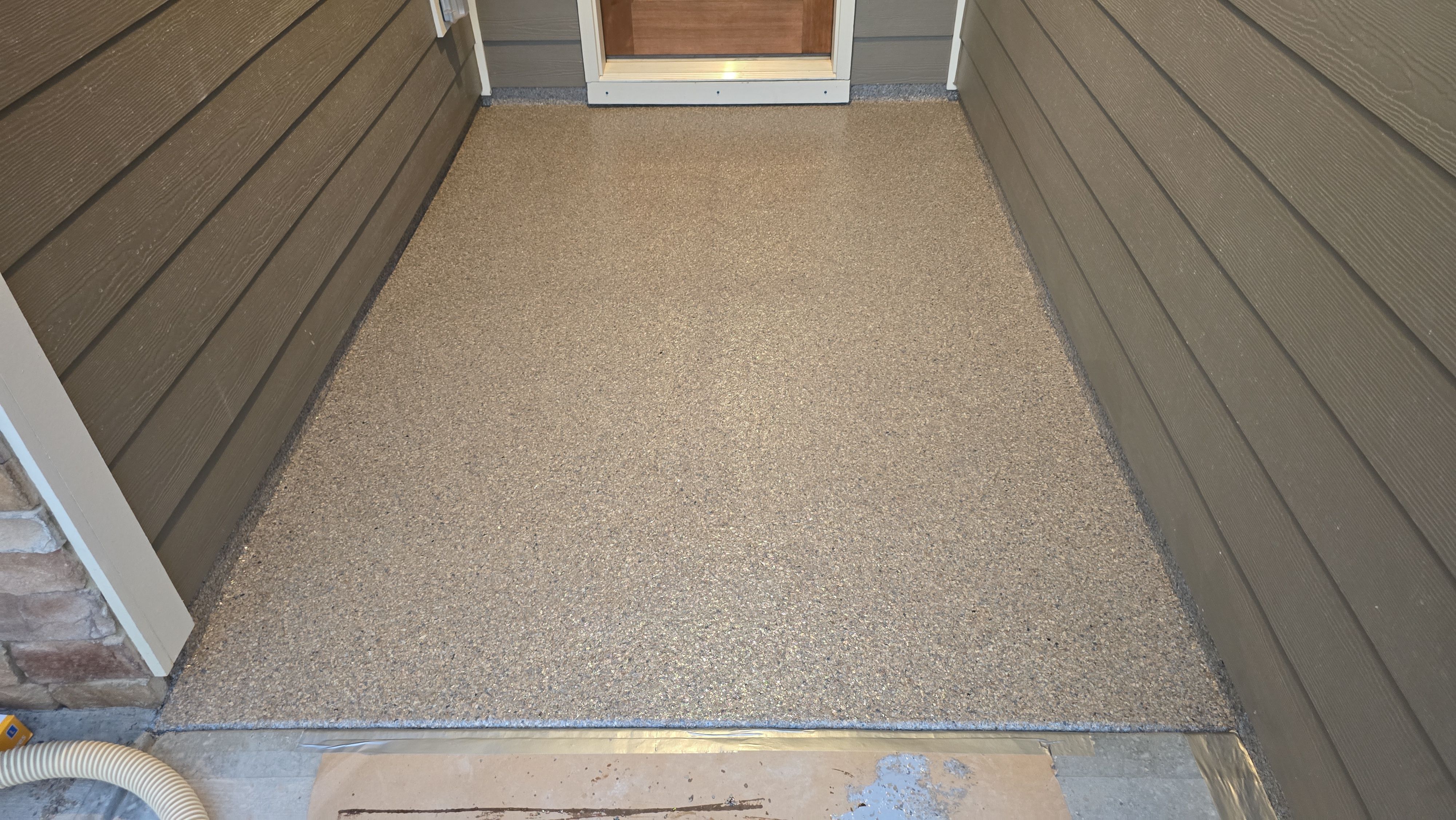 Garage, Back Porch, and Patio using Obsidian by Elite Floor Solutions