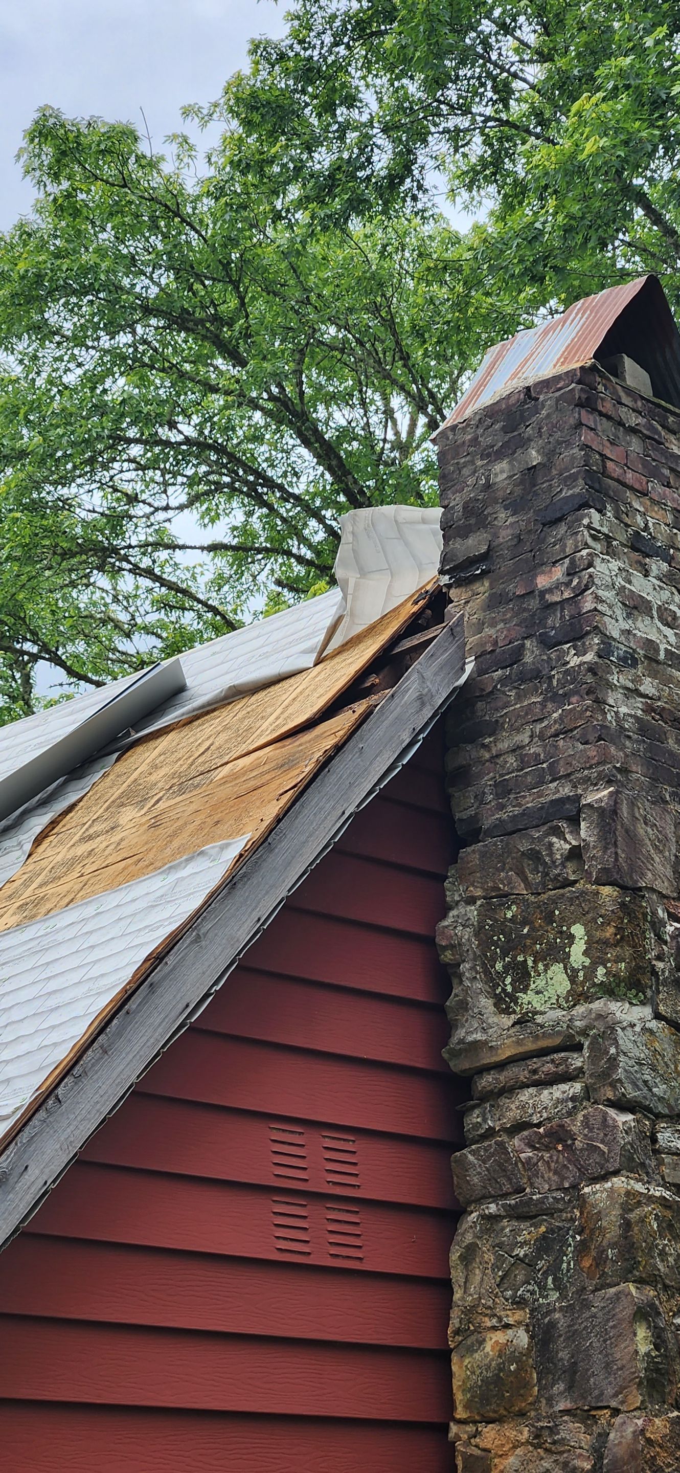 Residential Roofing Installation using 26 Gauge Colored Panels by Hostetler Roofing