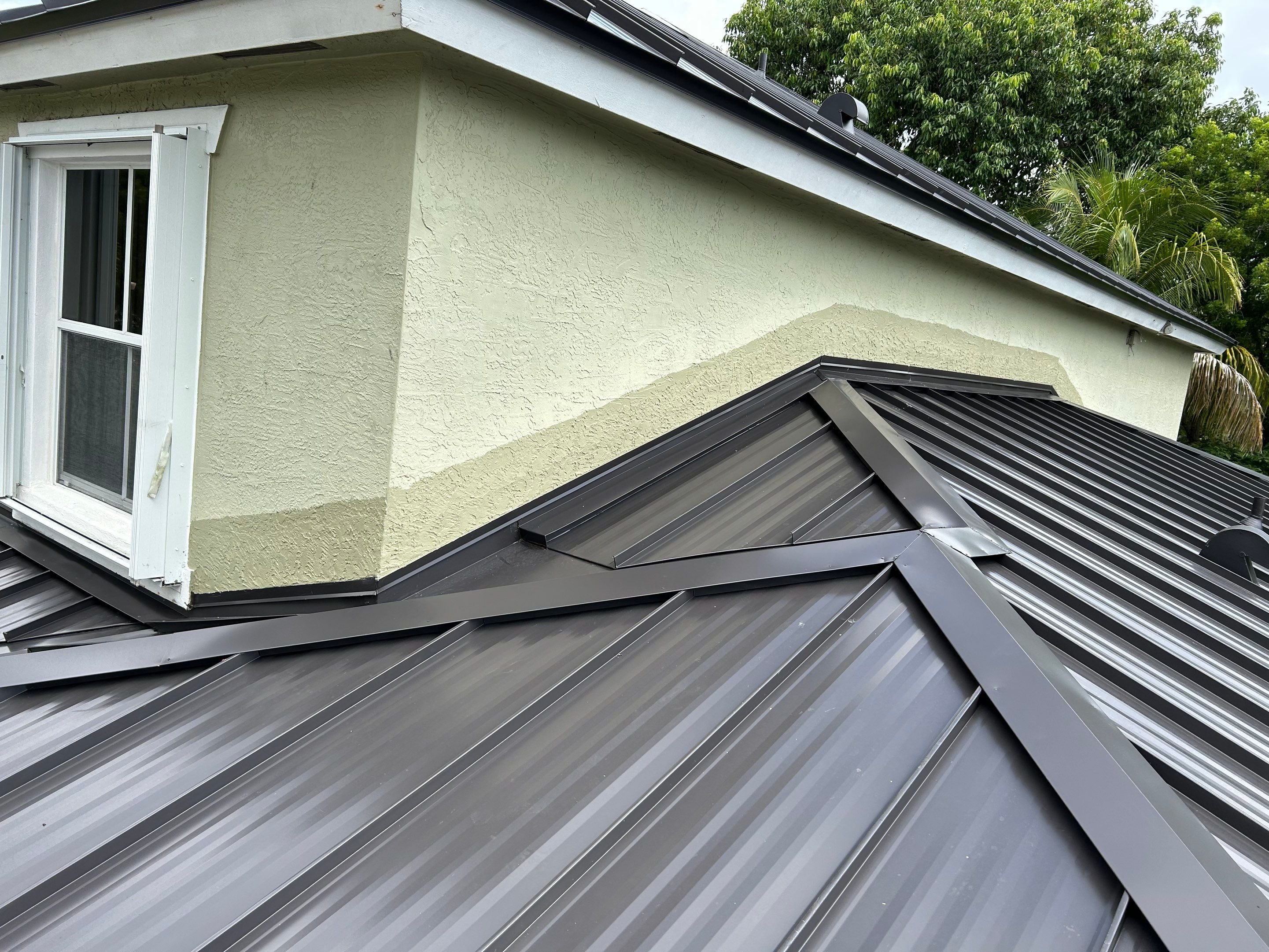 24ga 1.5" Mechanical Seam Dark Bronze by Total Roofing System The Metal Roof Experts