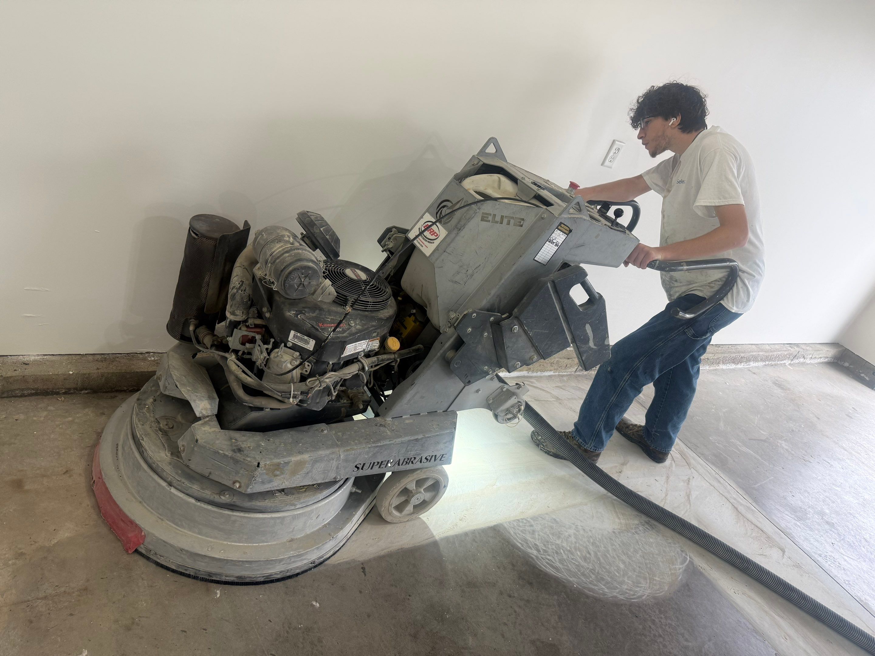 Full Garage Floor Resurfacing and Decorative Epoxy Flake Finish by Select Painting, Coatings & Garage Cabinets