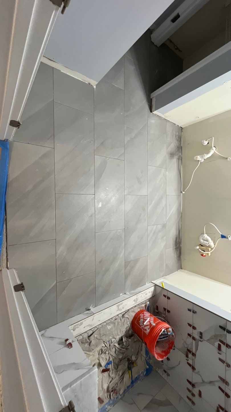 Tub to walk-in shower conversion, and tile flooring by Prudencio
