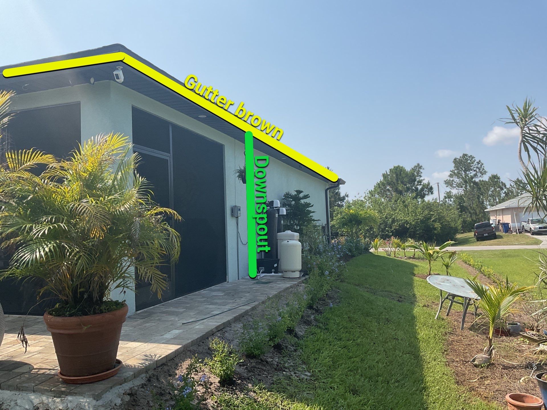 Musket Brown and New Downspouts in Lehigh Acres, FL  by Gutter Professors