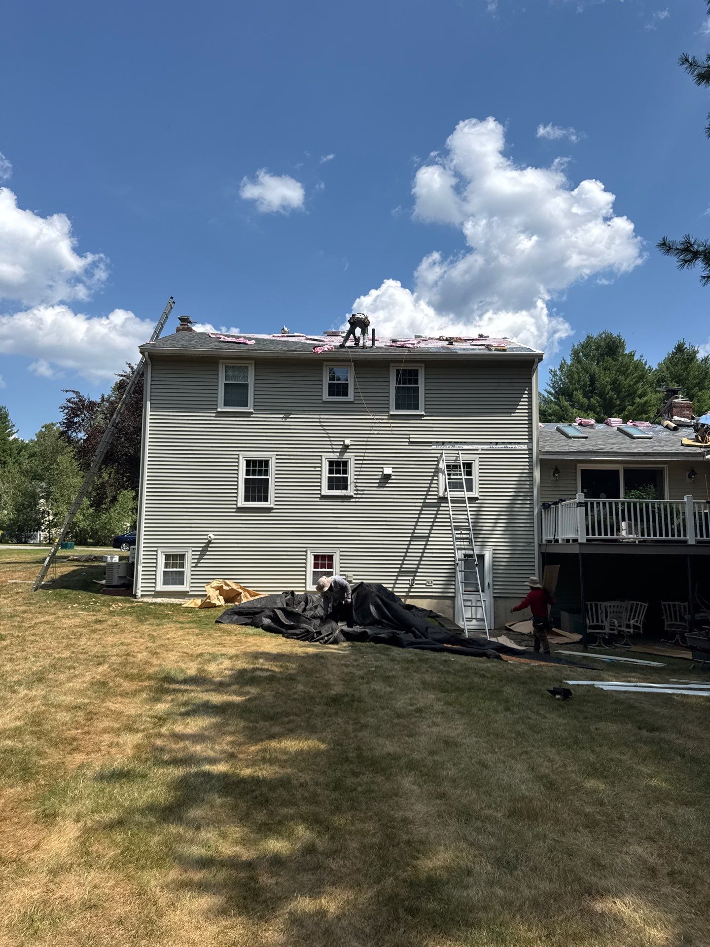 Complete Roof Replacement with Chimney Flashing, Gutter Guard System, and Vinyl Siding Repairs by Mighty Dog Roofing of Greater Middlesex County