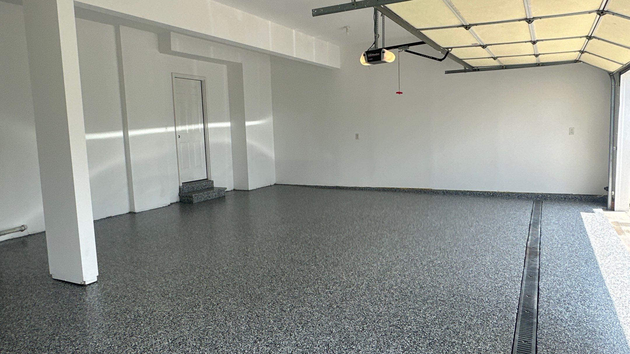 Laura B. garage transformation with a new floor and garage storage by Banner Garage